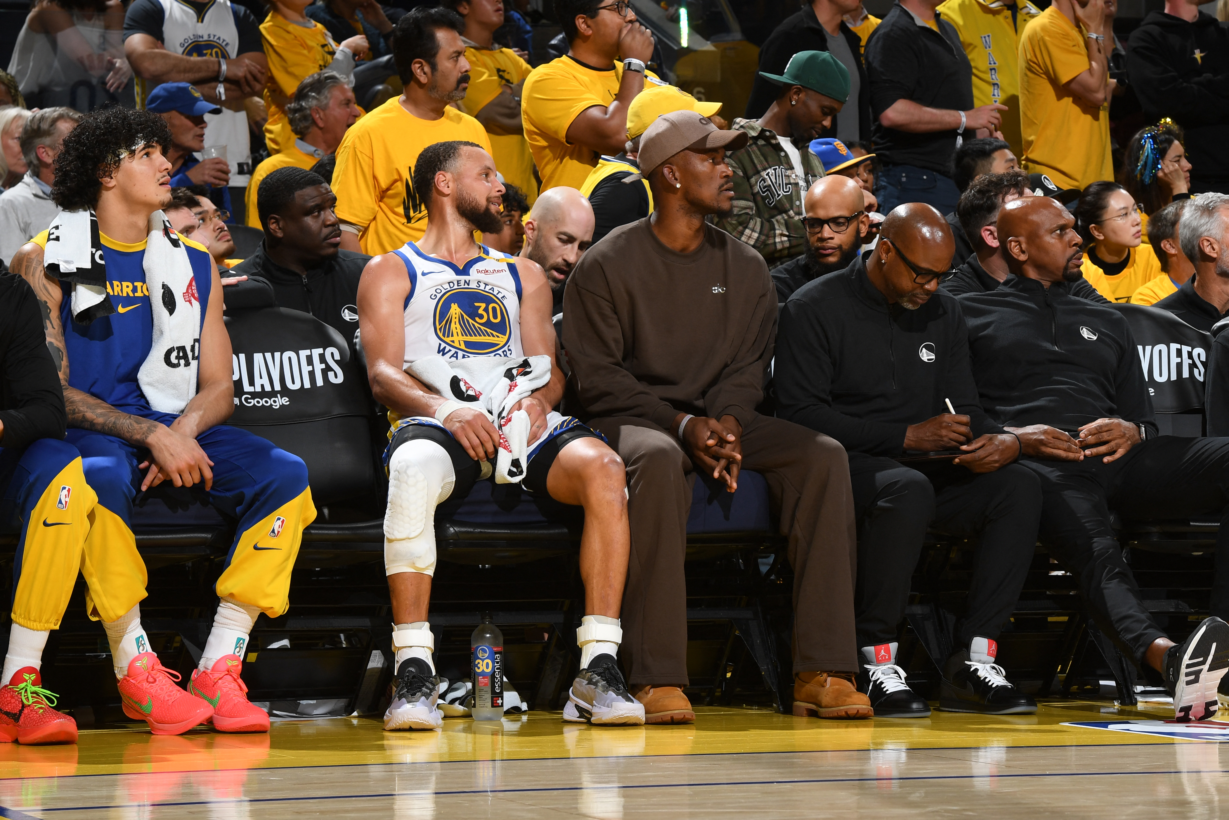Stephen Curry and Jimmy Butler react.