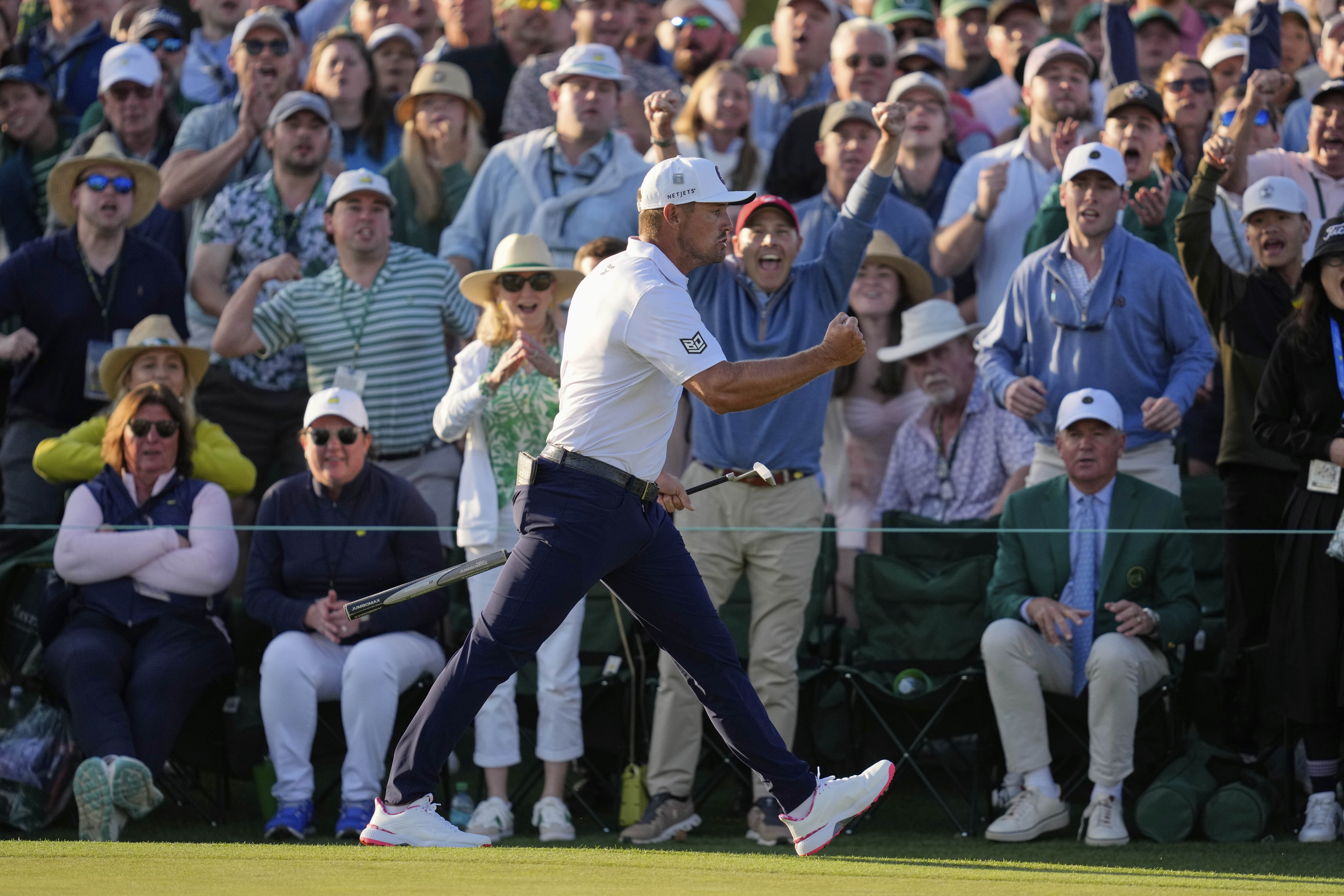 Bryson DeChambeau celebrates after a birdie on the 18th hole during the third round at the Masters golf tournament, Saturday, April 12, 2025, in Augusta, Ga. (AP Photo/Ashley Landis)