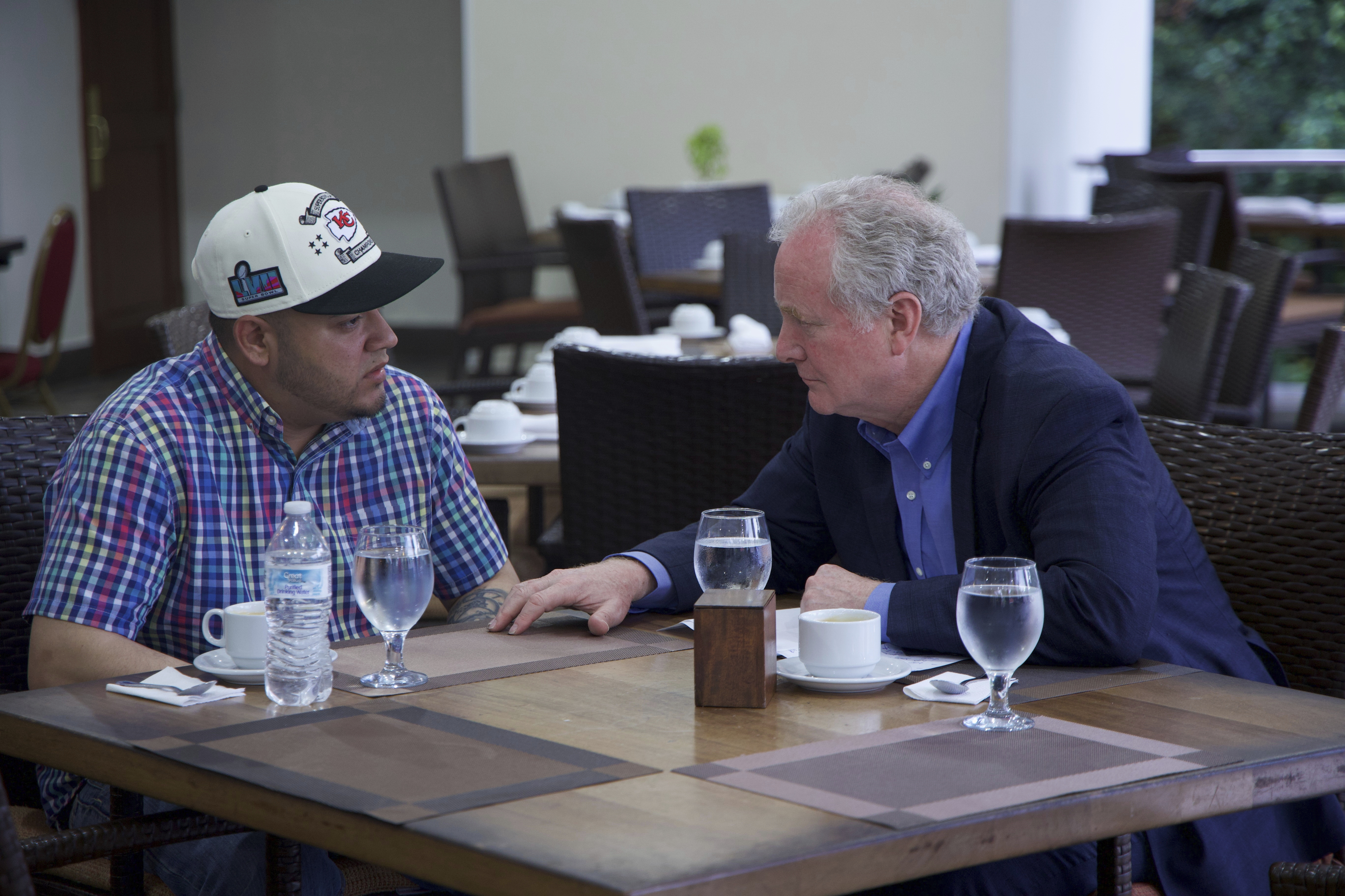 Maryland Senator Chris Van Hollen, right, speaks with Kilmar Abrego Garcia.