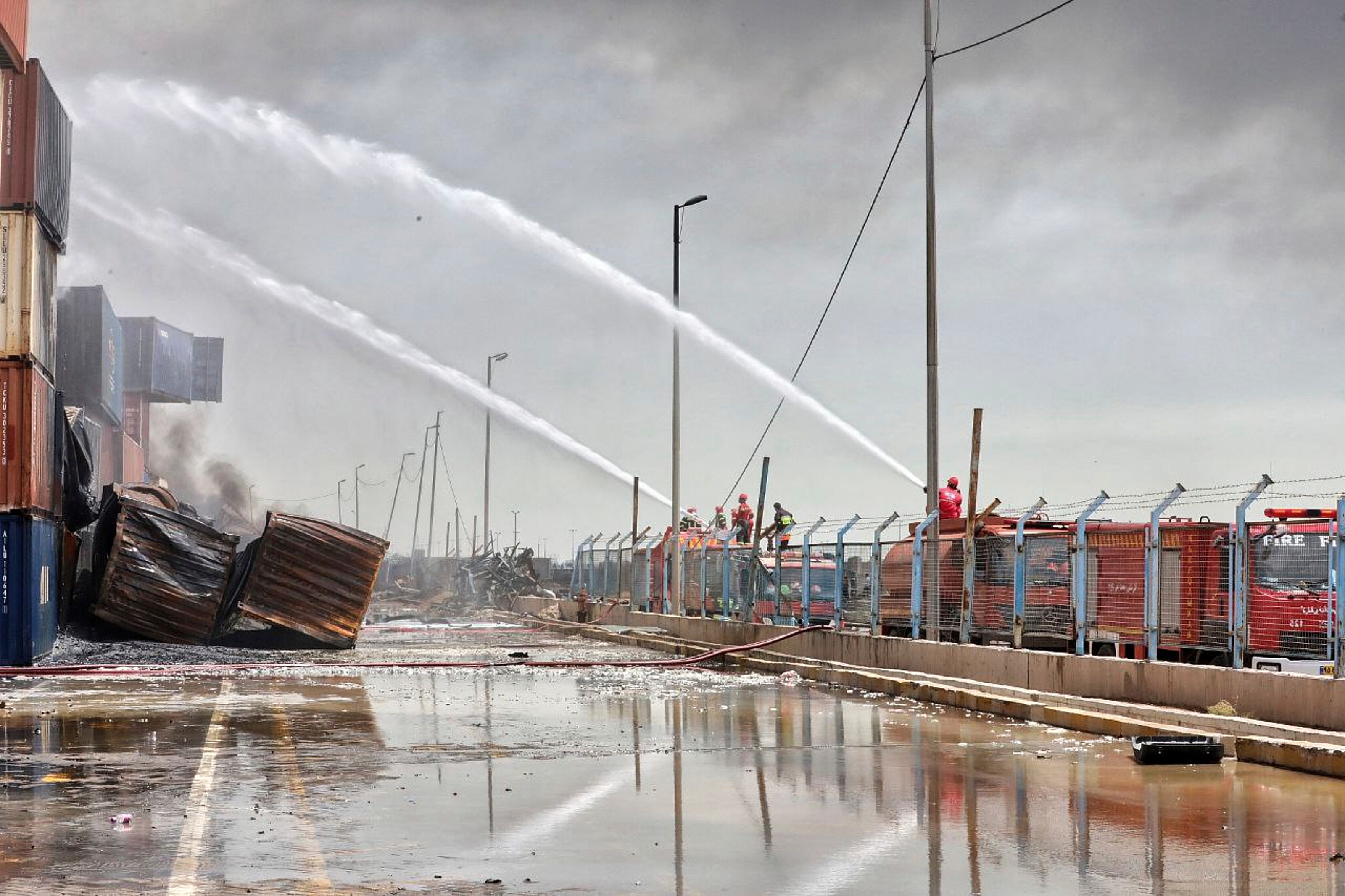 Firefighters try to extinguish the fire after a massive explosion and fire rocked the Shahid Rajaei port near the southern port city of Bandar Abbas, Iran, on April 27, 2025.