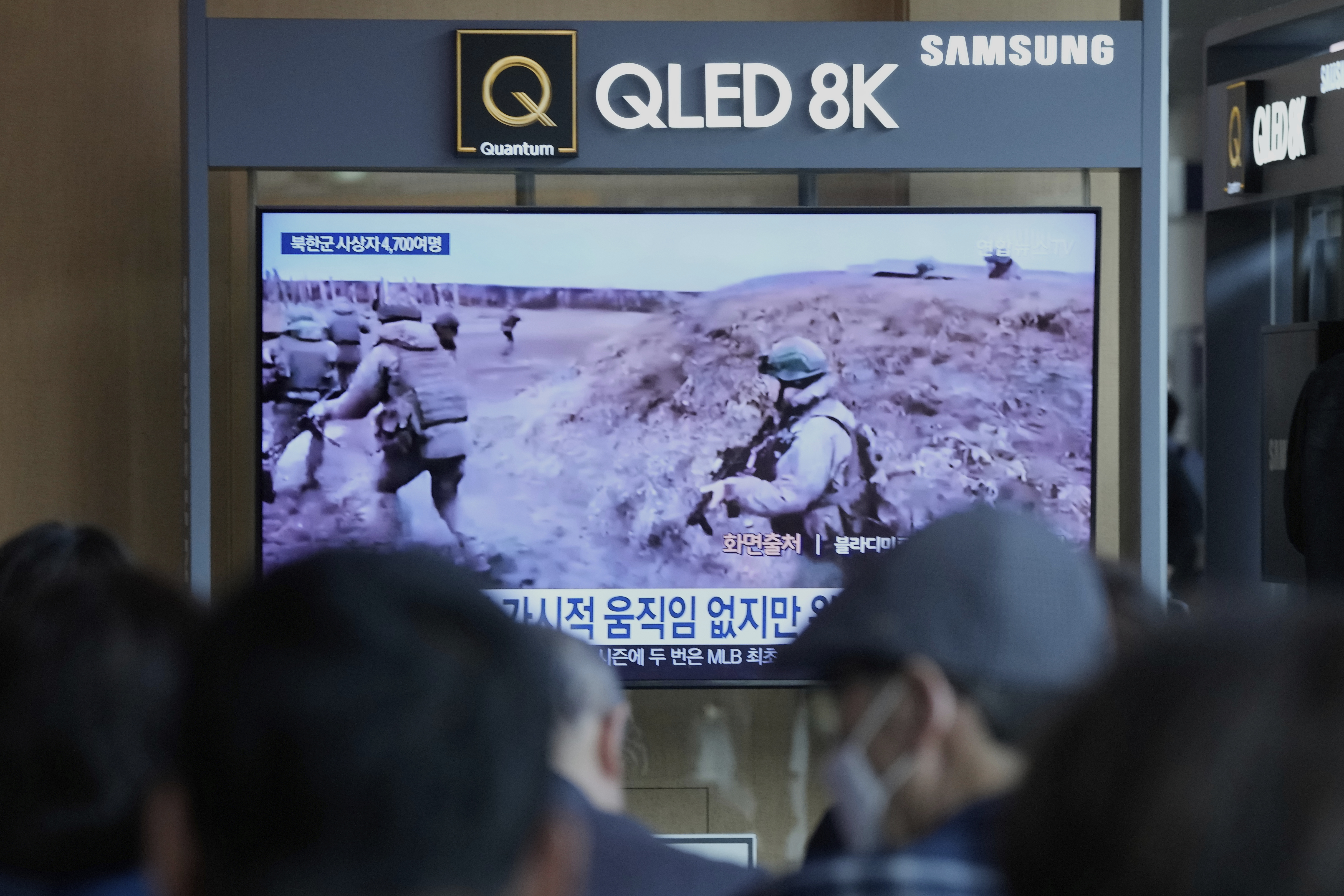 People watch in TV an undated image, released in a Telegram post by Vladimir Solovyov, a presenter for Russian state television, of North Korean soldiers undergoing combat training in Russia, during a news program at the Seoul Railway Station in Seoul, South Korea, Wednesday, April 30, 2025. (AP Photo/Ahn Young-joon)