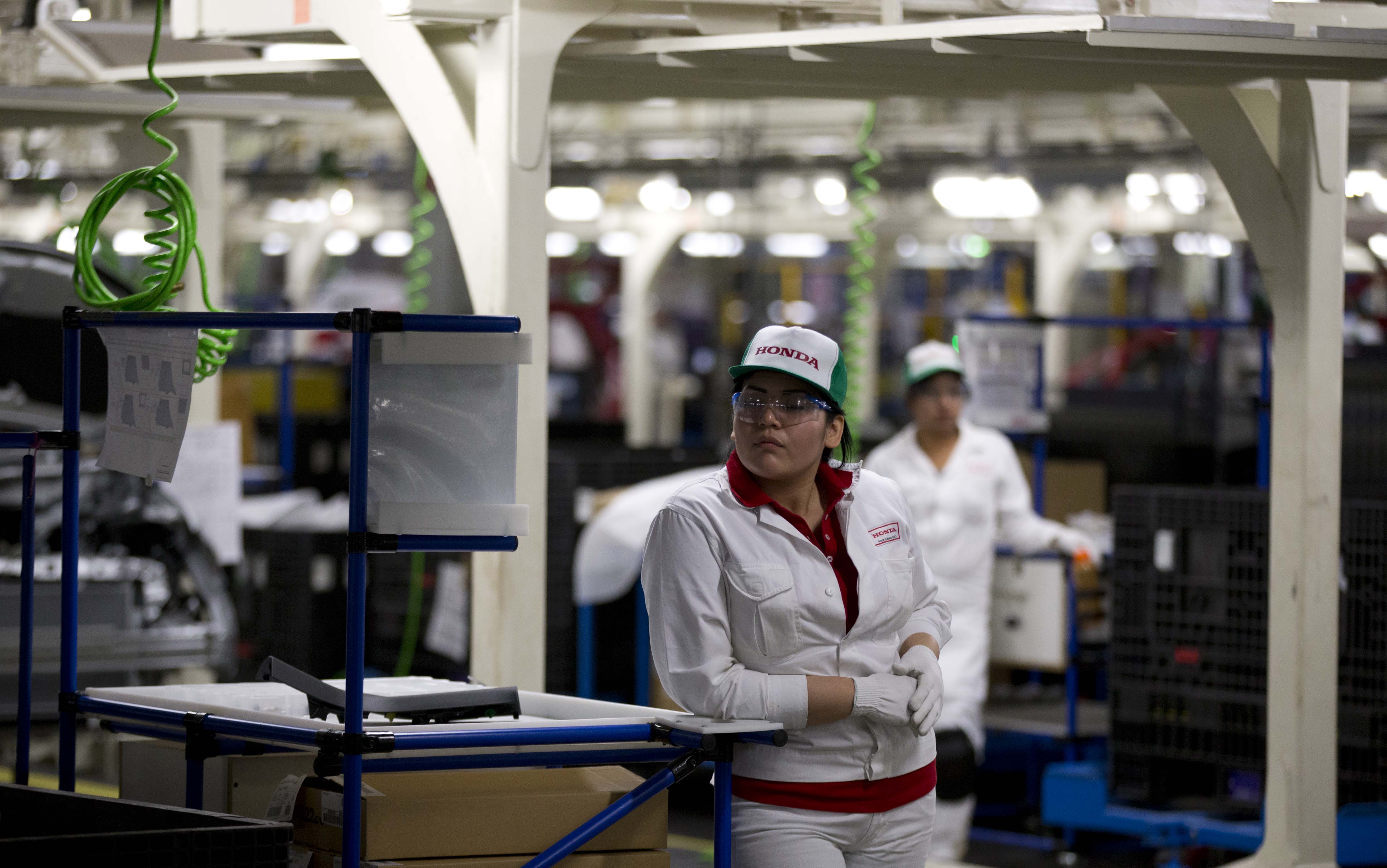 An employee stands inside the new multibillion-dollar Honda car plant in Celaya, in the central Mexican state of Guanajuato
