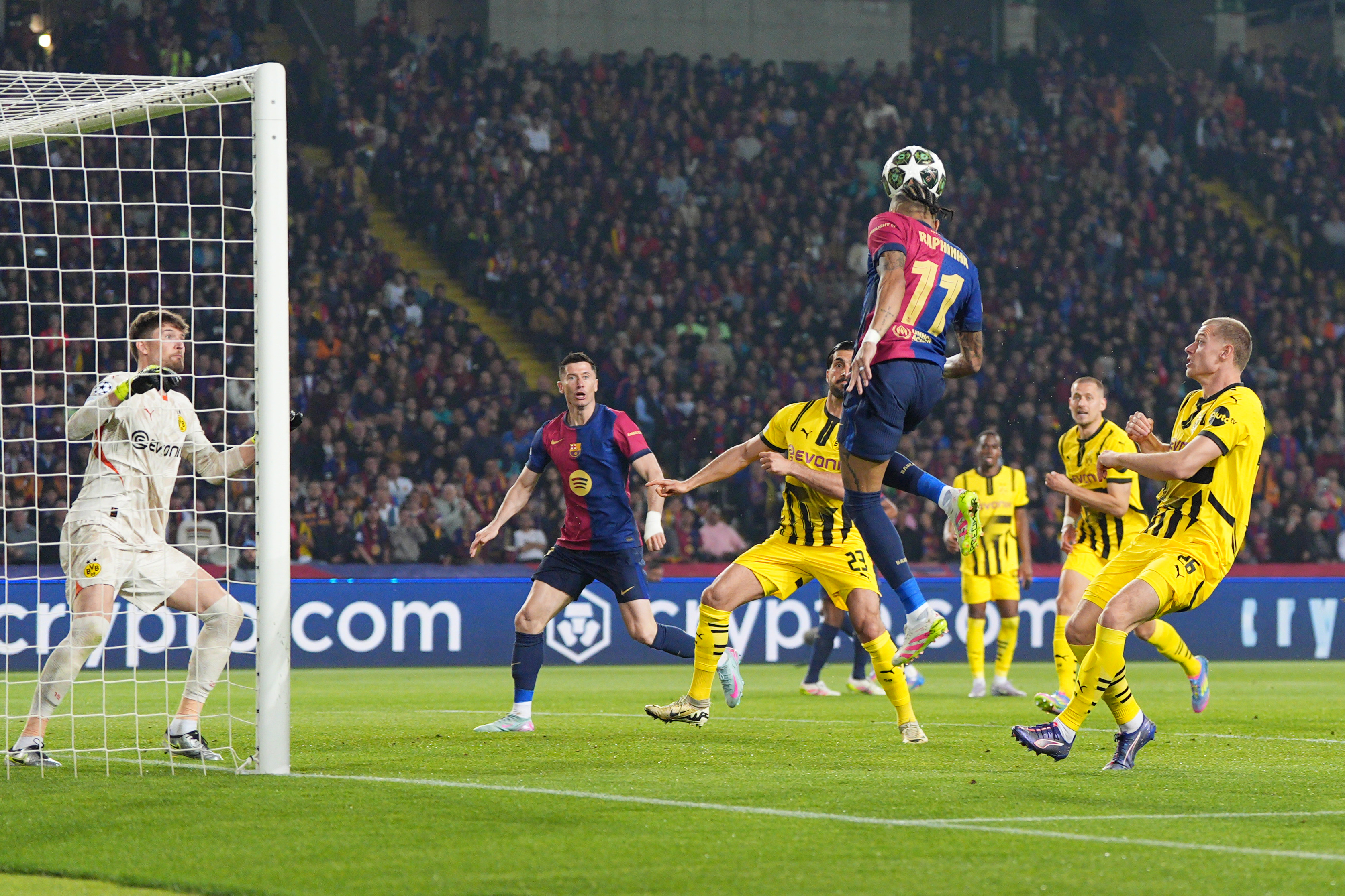 BARCELONA, SPAIN - APRIL 09: Raphinha of FC Barcelona heads the ball across goal before team mate Robert Lewandowski scores his team's second goal during the UEFA Champions League 2024/25 Quarter Final First Leg match between FC Barcelona and Borussia Dortmund at Estadi Olimpic Lluis Companys on April 09, 2025 in Barcelona, Spain. (Photo by Pedro Salado/Getty Images)