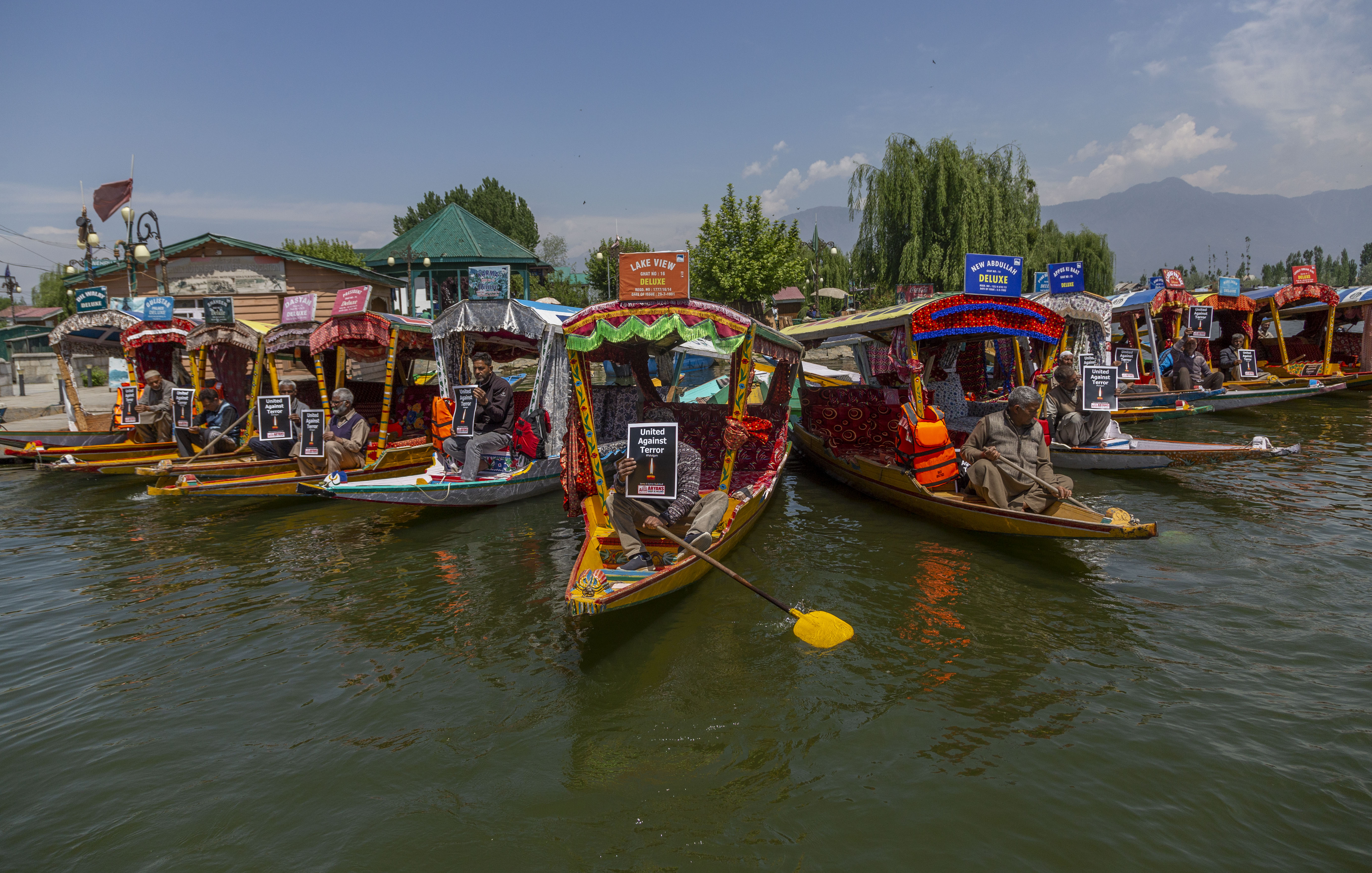 Kashmiri boatmen hold placards during a protest following an attack on Indian tourists by gunmen at the Baisaran meadow near Pahalgam in Indian-administered Kashmir on April 22, 2025, killing at least 26 people and injuring more than 20 in one of the deadliest attacks on civilians in the region in recent years [Yawar Nazir/Getty Images]