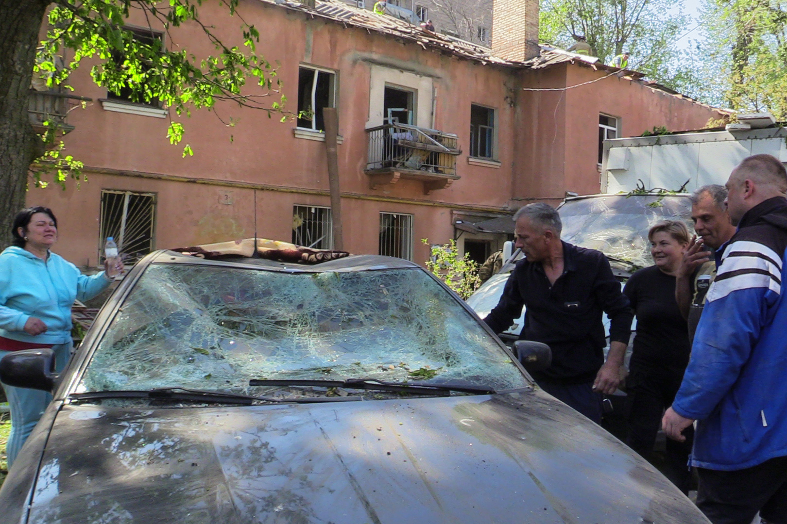 The shockwave from the missile damaged nearby cars and buildings-