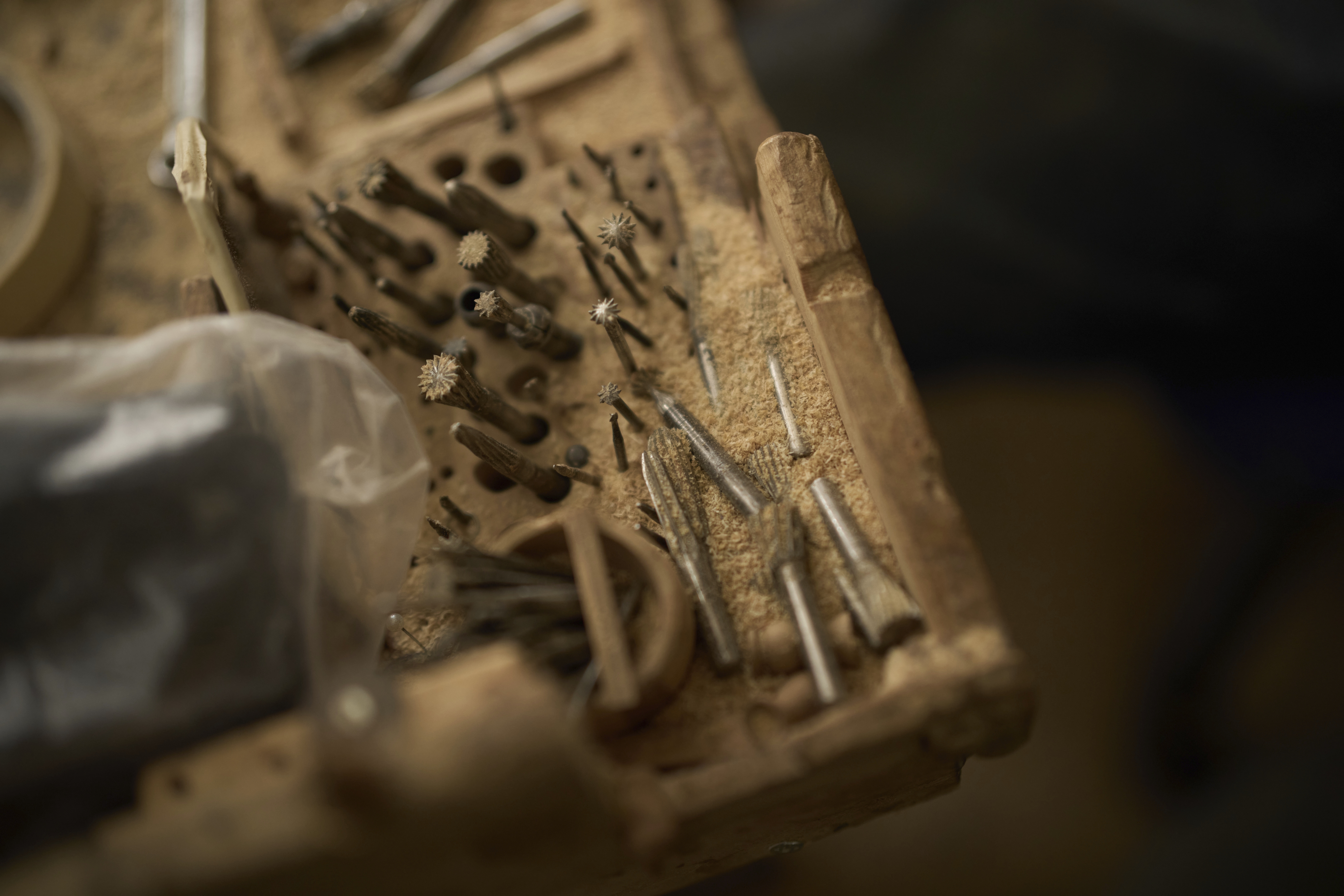 Wood-carving tools are seen on a table at the a workshop specialized in biblically themed olive wood sculptures, in the West Bank city of Bethlehem, Tuesday, April 8, 2025. (AP Photo/Leo Correa)