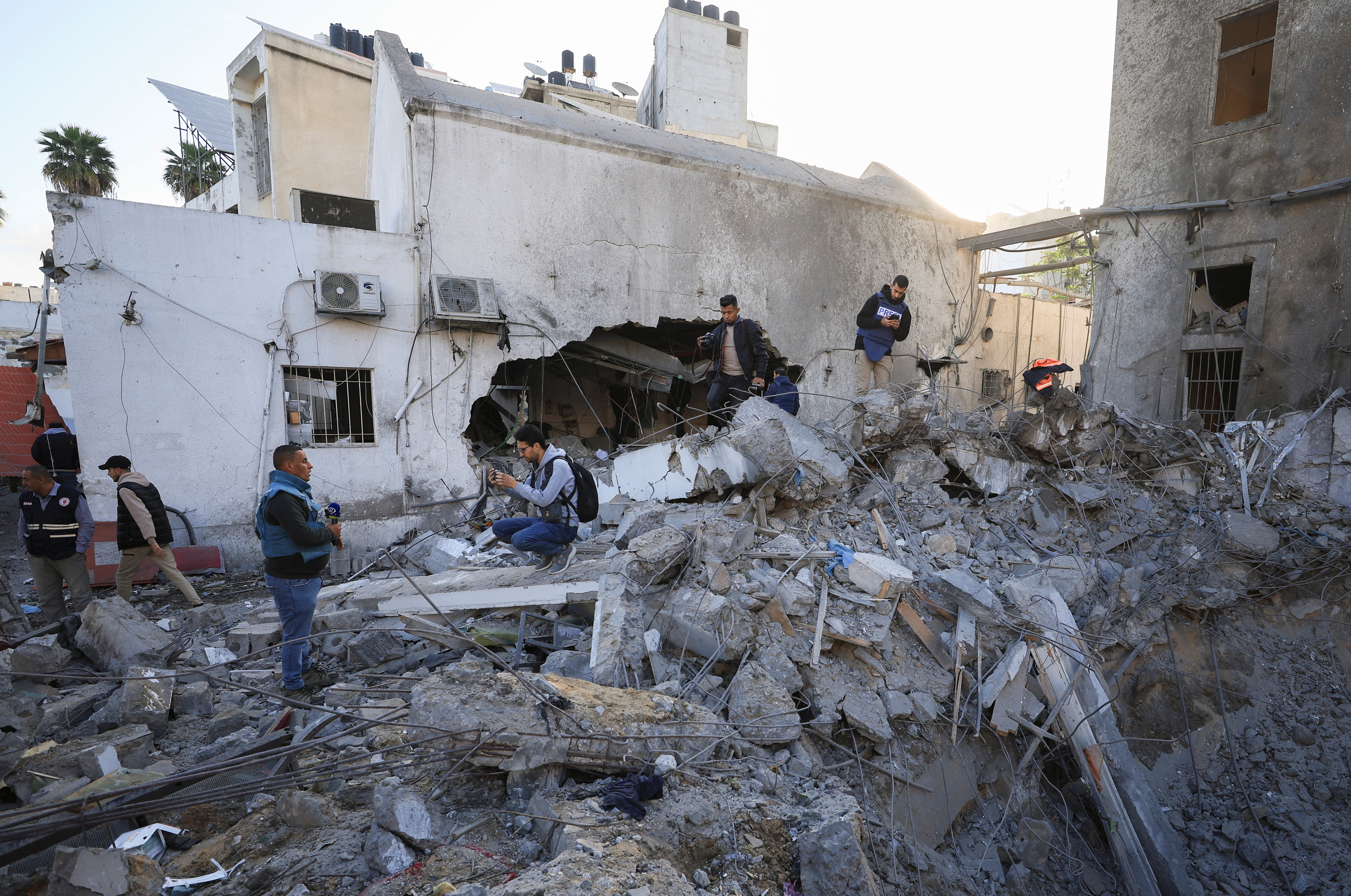 Palestinians inspect a site where medics said two Israeli missiles hit a building inside the Al-Ahli Arab Baptist Hospital, shortly after patients were evacuated following a call from someone who identified himself with Israeli security, in Gaza City, April 13, 2025. REUTERS/Dawoud Abu Alkas