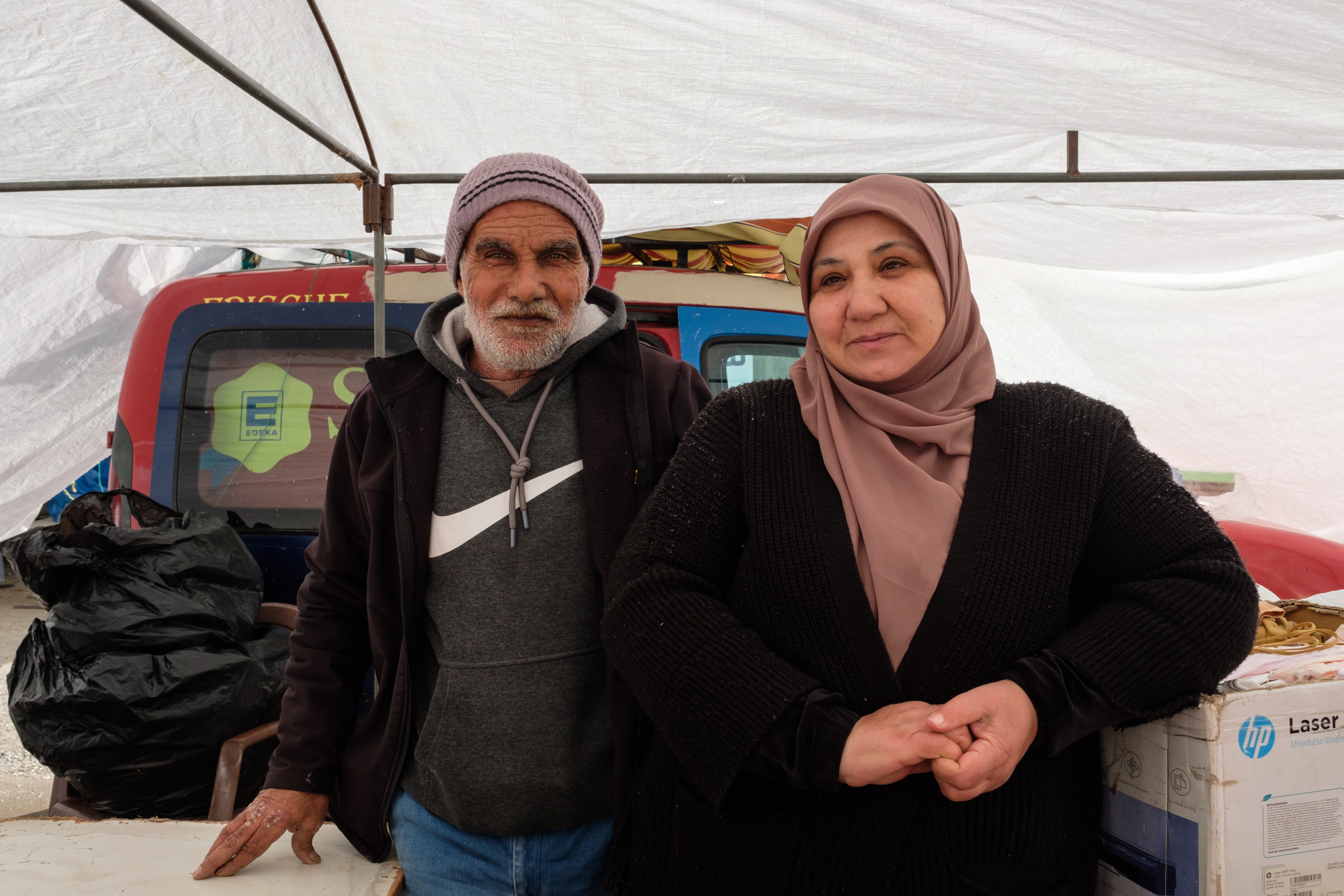 A man standing next to a woman