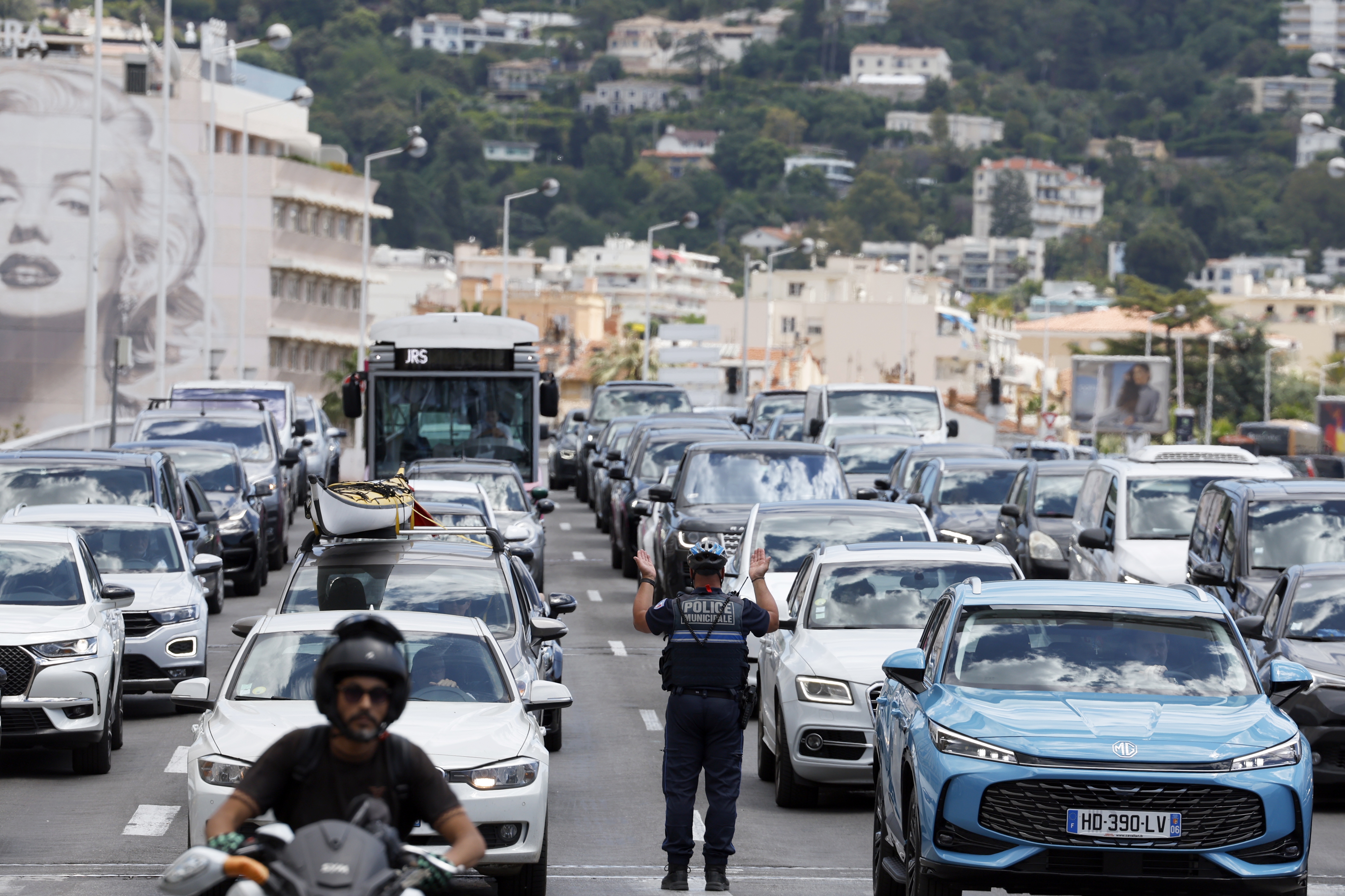 Policeman directs traffic following a power outage in southern France