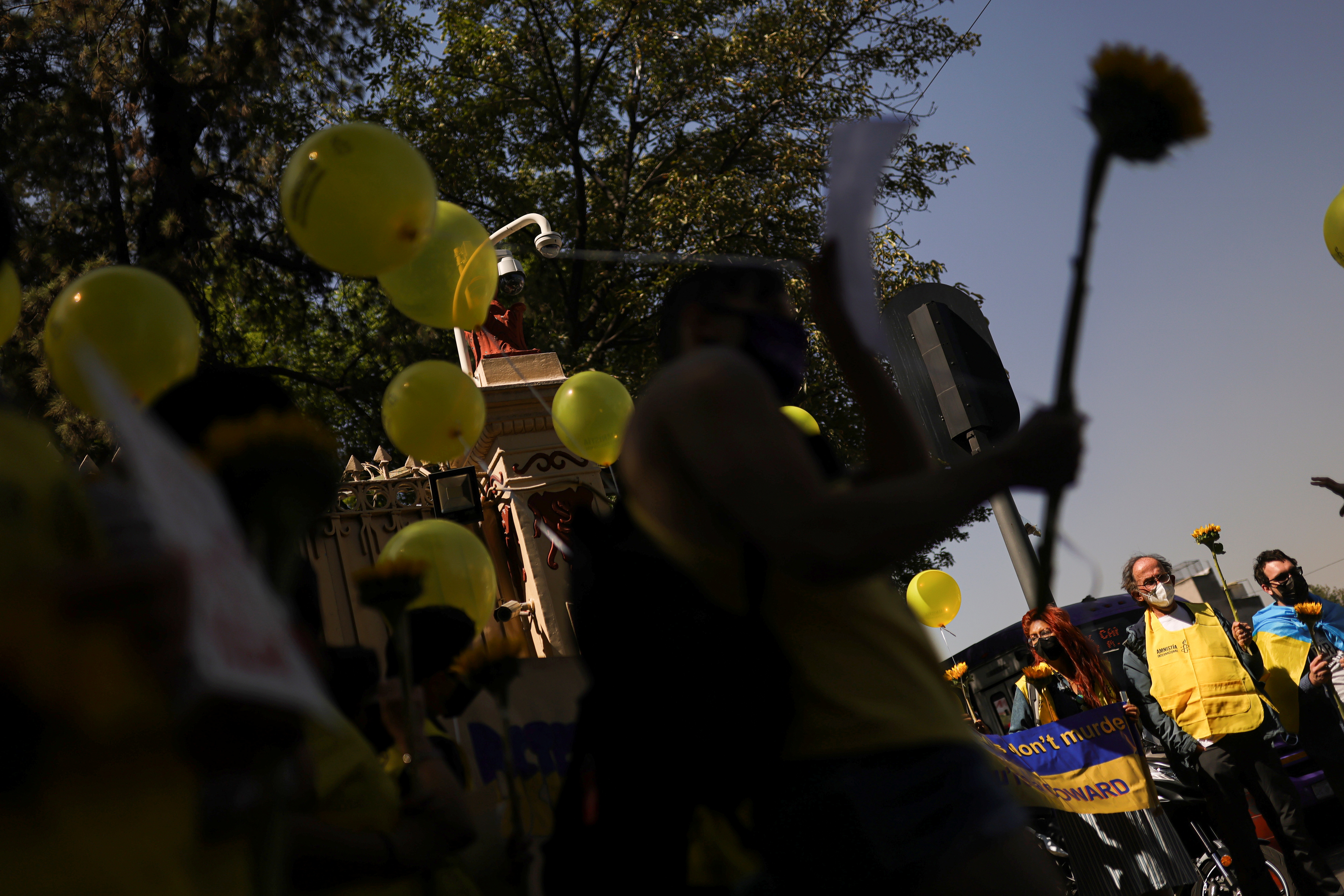 Activists from Amnesty International protest outside the Russian Embassy in Mexico City.