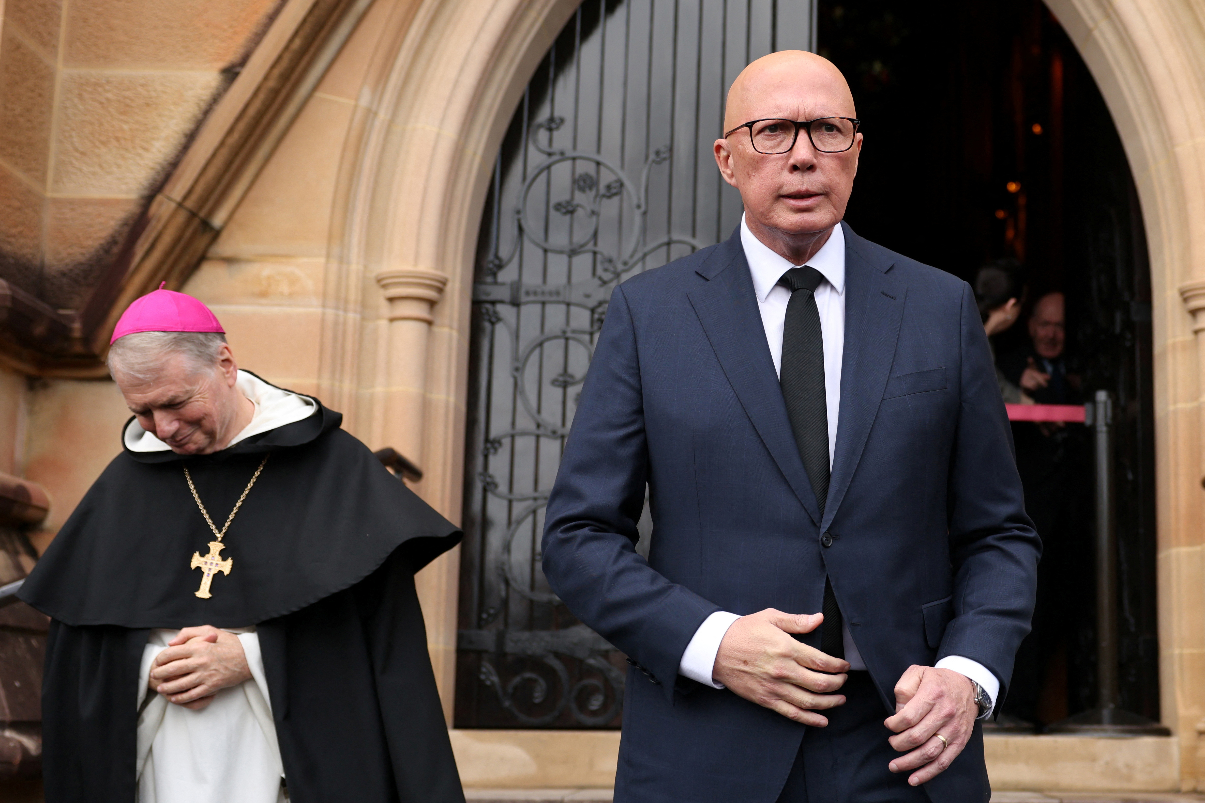 The Archbishop of Sydney Anthony Fisher and Liberal Party leader Peter Dutton react after attending Mass, following the death of Pope Francis, at Saint Mary's Cathedral in Sydney, Australia, April 22, 2025. REUTERS/Hollie Adams
