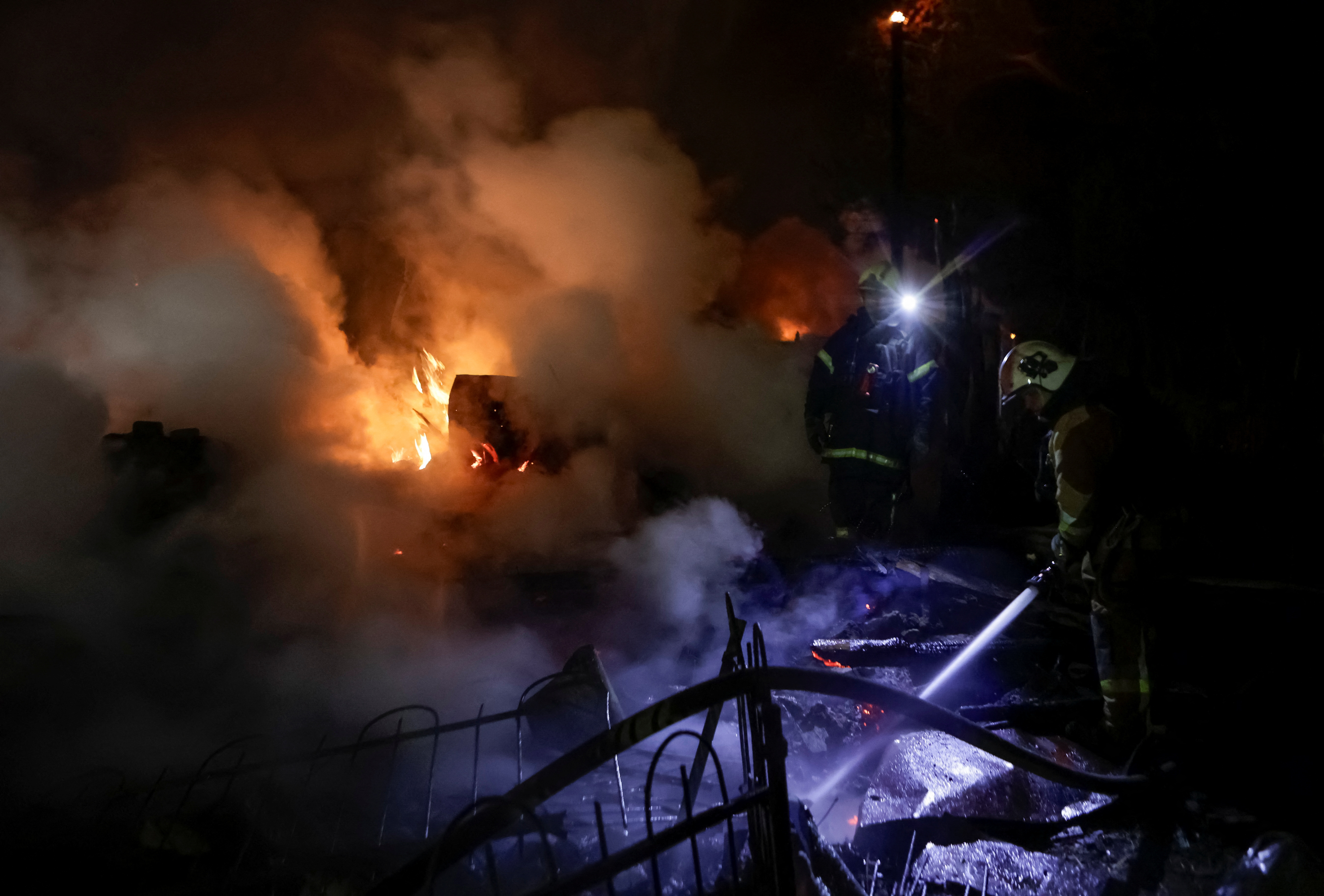 Firefighters work at the site of a Russian drone strike, amid Russia's attack on Ukraine, in Kharkiv, Ukraine April 29, 2025.