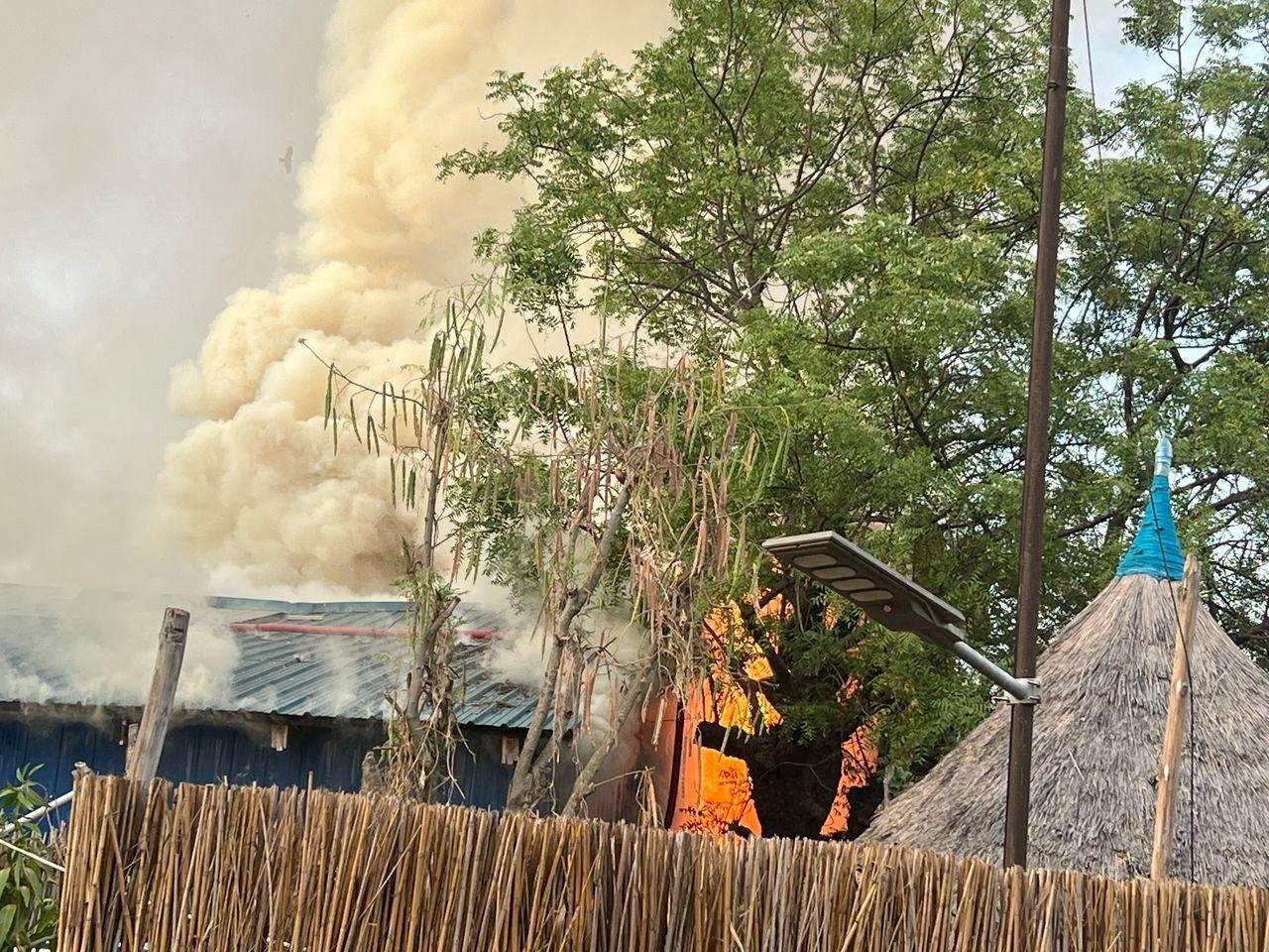 A fire burns following an aerial bombardment.