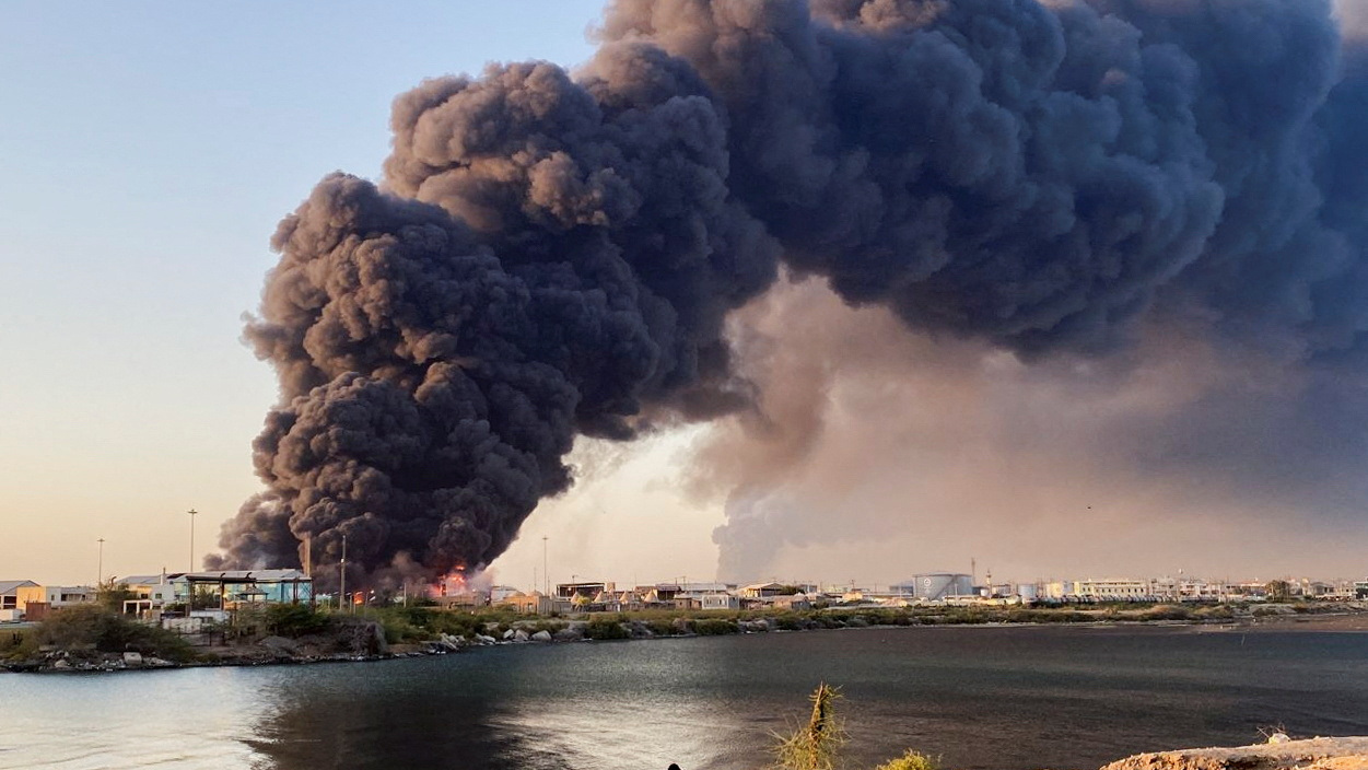 A view shows a large plume of smoke rising from fuel depot in Port Sudan, Sudan, May 6, 2025. REUTERS/Khalid Abdelaziz TPX IMAGES OF THE DAY