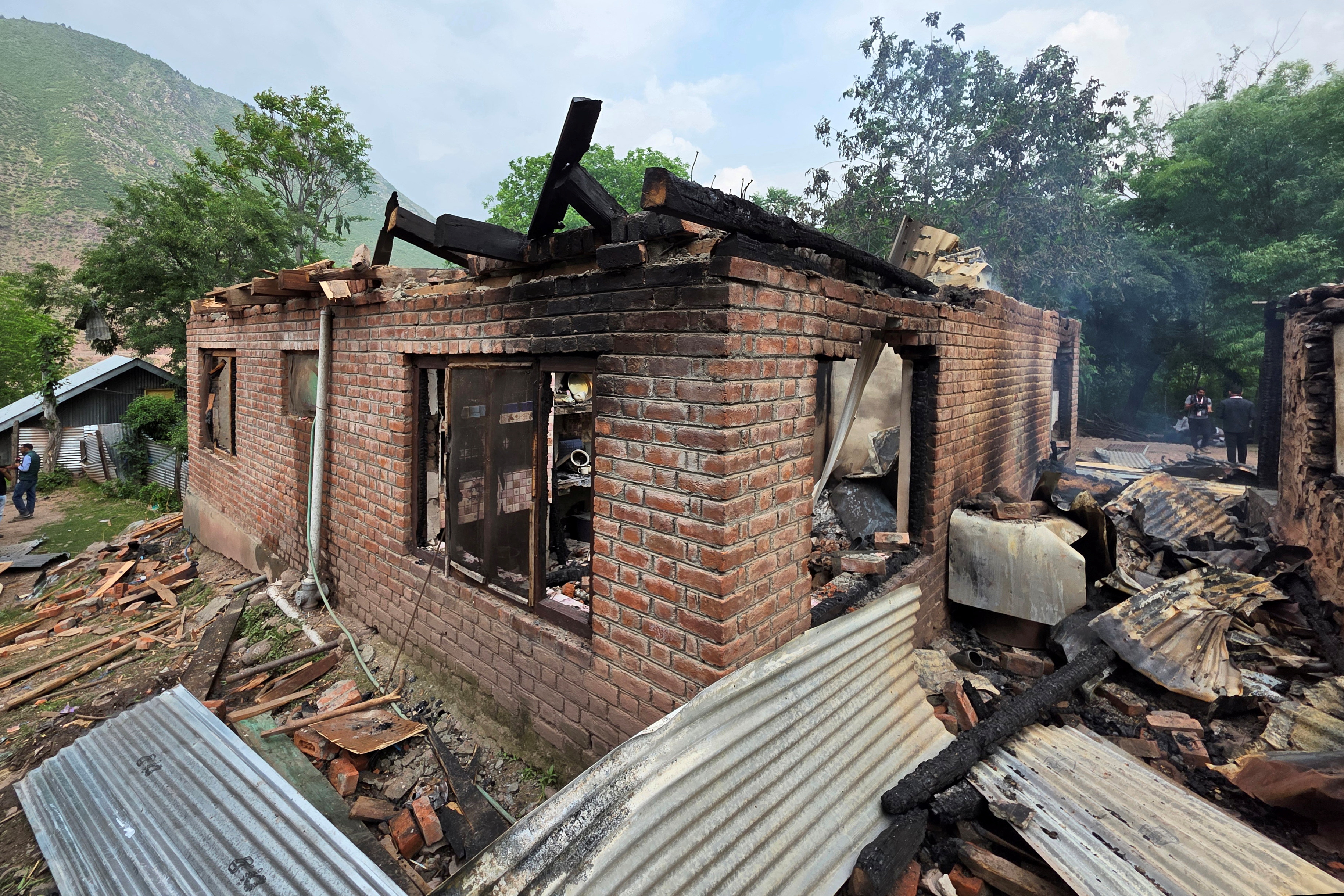 A residential house is pictured after it was damaged by a cross-border shelling in Salamabad in India-administered Kashmir