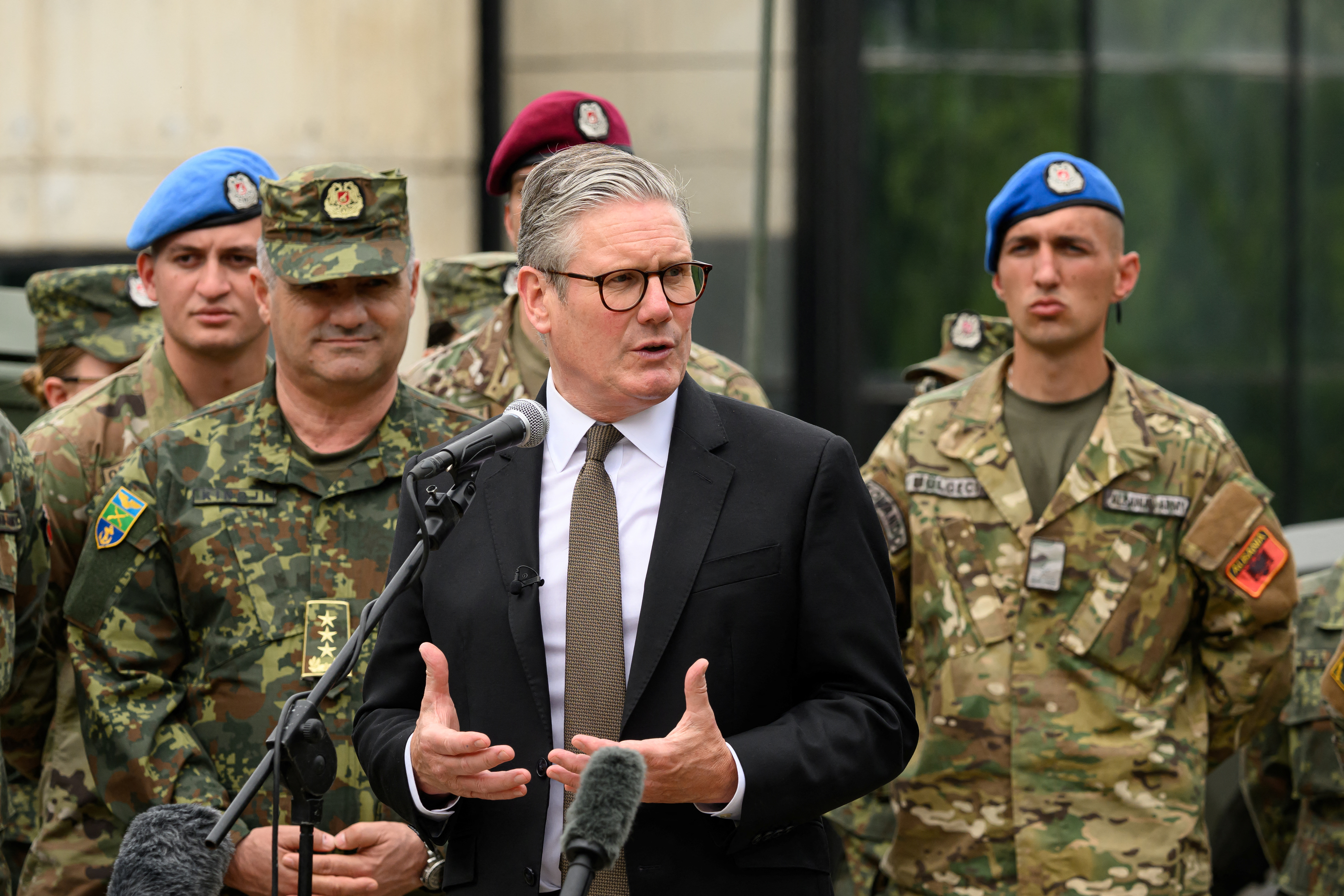 Britain's Prime Minister Keir Starmer speaks to British and Albanian troops