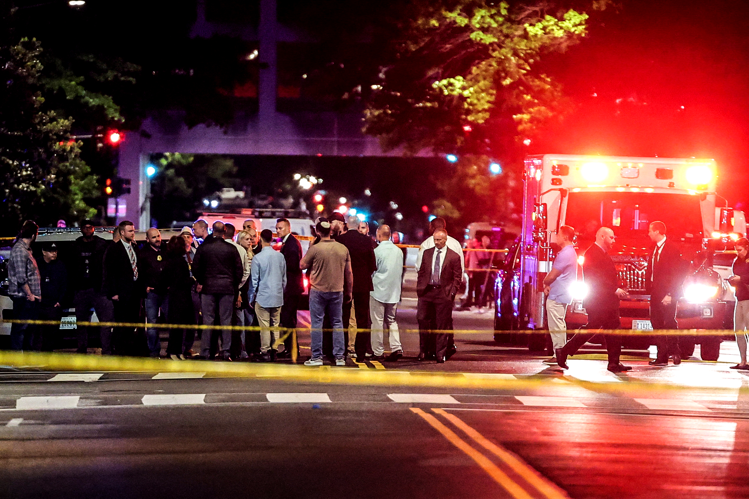 U.S. Attorney General Pam Bondi and Israeli Ambassador to the U.S. Yechiel Leiter speak to the law enforcement officials as they visit the site where, according to the U.S. Homeland Security Secretary, two Israeli embassy staff were shot dead near the Capital Jewish Museum in Washington, D.C., U.S. May 22, 2025. REUTERS/Jonathan Ernst