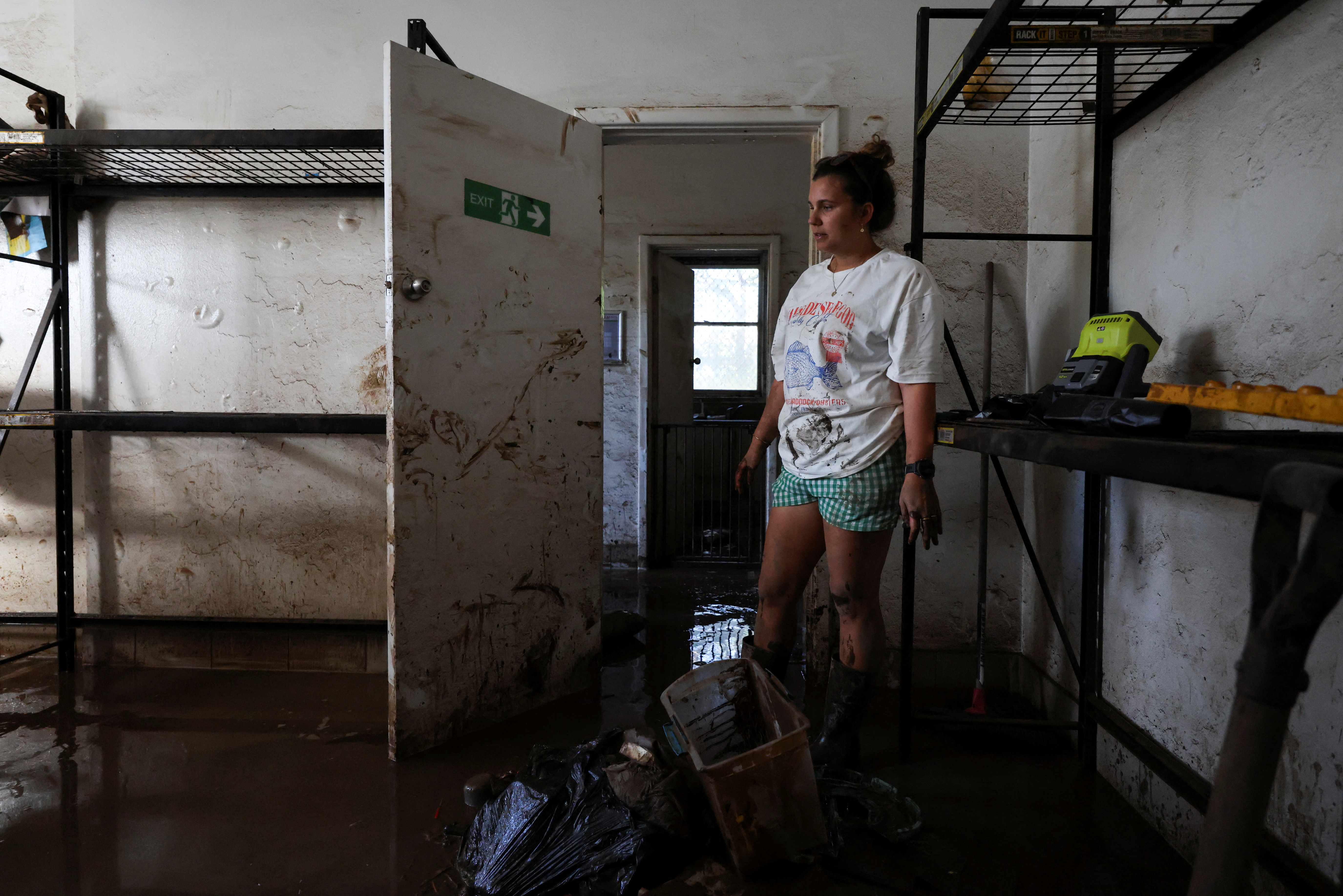 Joanna Ally, employee, reacts as she cleans up the Manning Support Services centre in Taree
