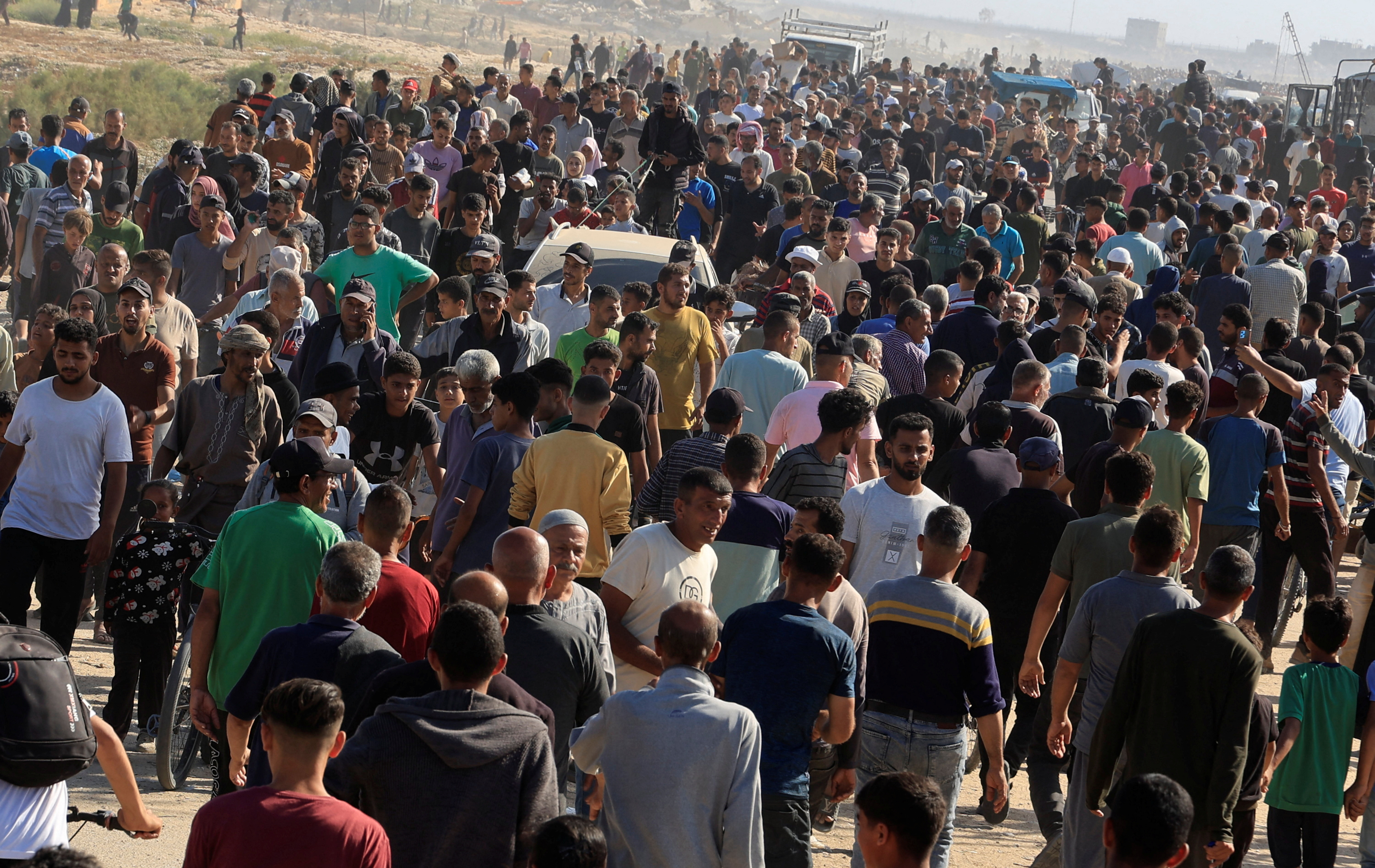 Palestinians seeking aid gather near an aid distribution site run by the U.S.-backed Gaza Humanitarian Foundation, in Rafah