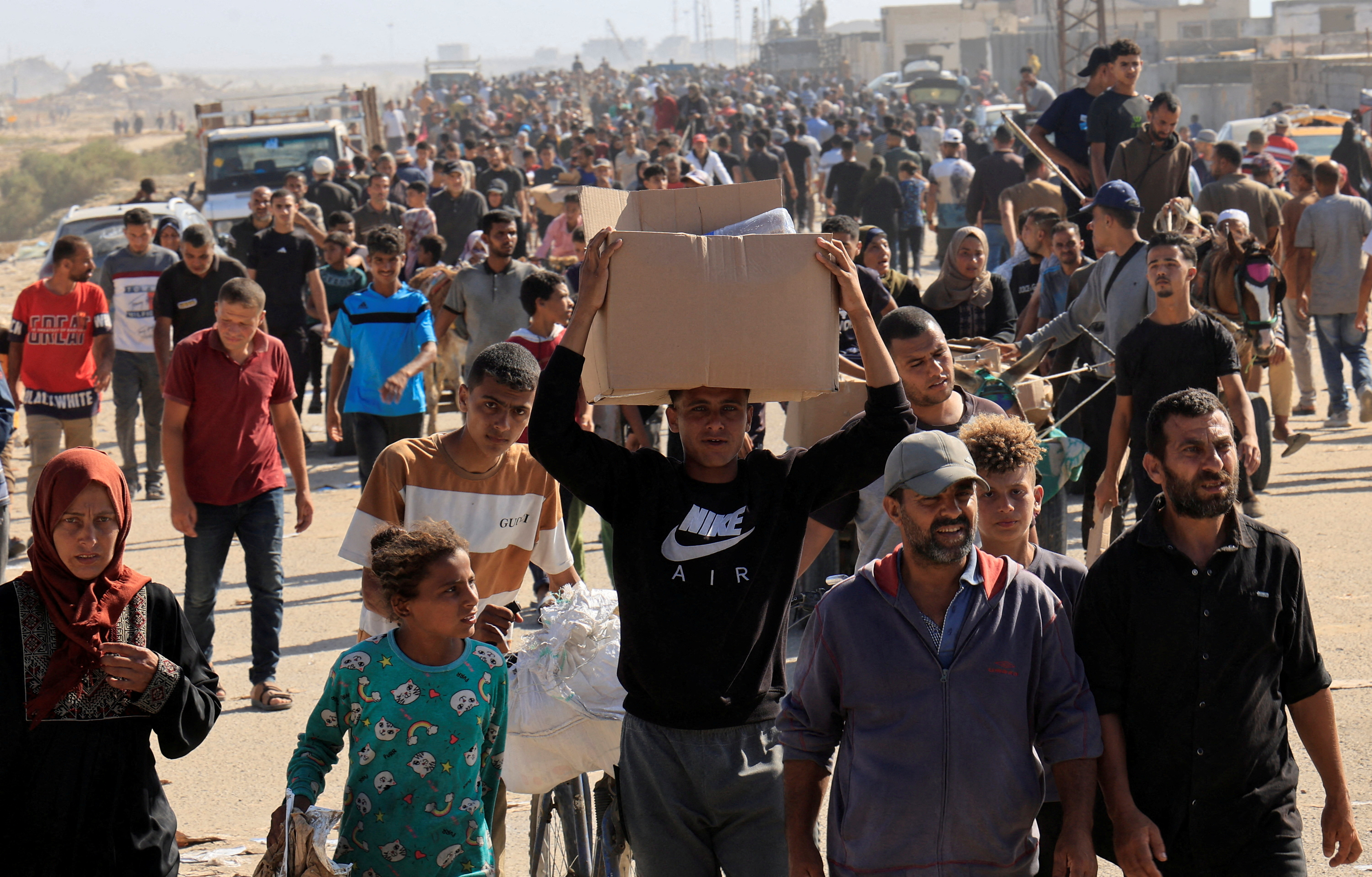 Palestinians seeking aid gather near an aid distribution site run by the US-backed Gaza Humanitarian Foundation, in Rafah, in the southern Gaza Strip, May 27, 2025. [Hatem Khaled/Reuters]