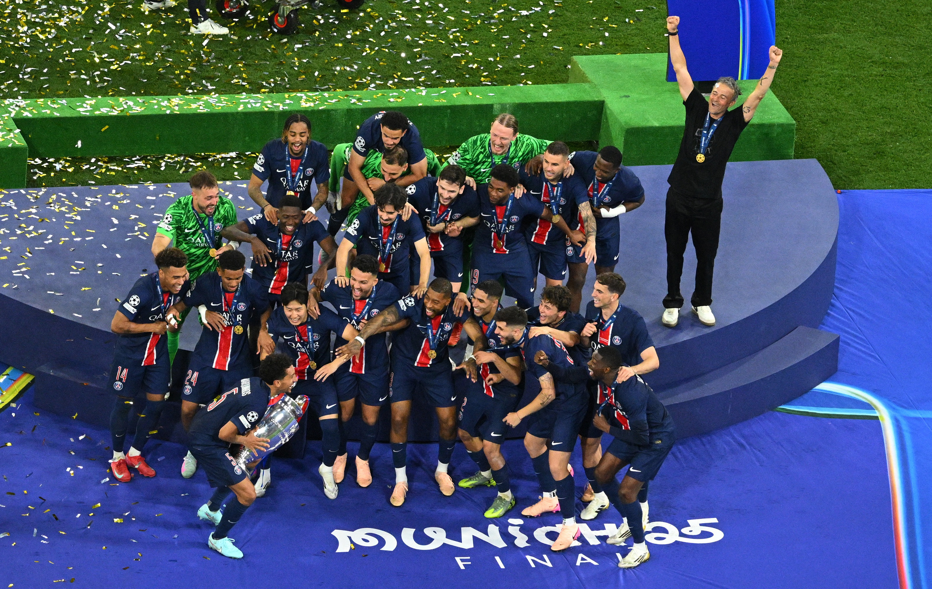 Champions League - Final - Paris St Germain v Inter Milan - Allianz Arena, Munich, Germany - May 31, 2025 Paris St Germain's Marquinhos before lifts the trophy as he celebrates with teammates after winning the Champions League