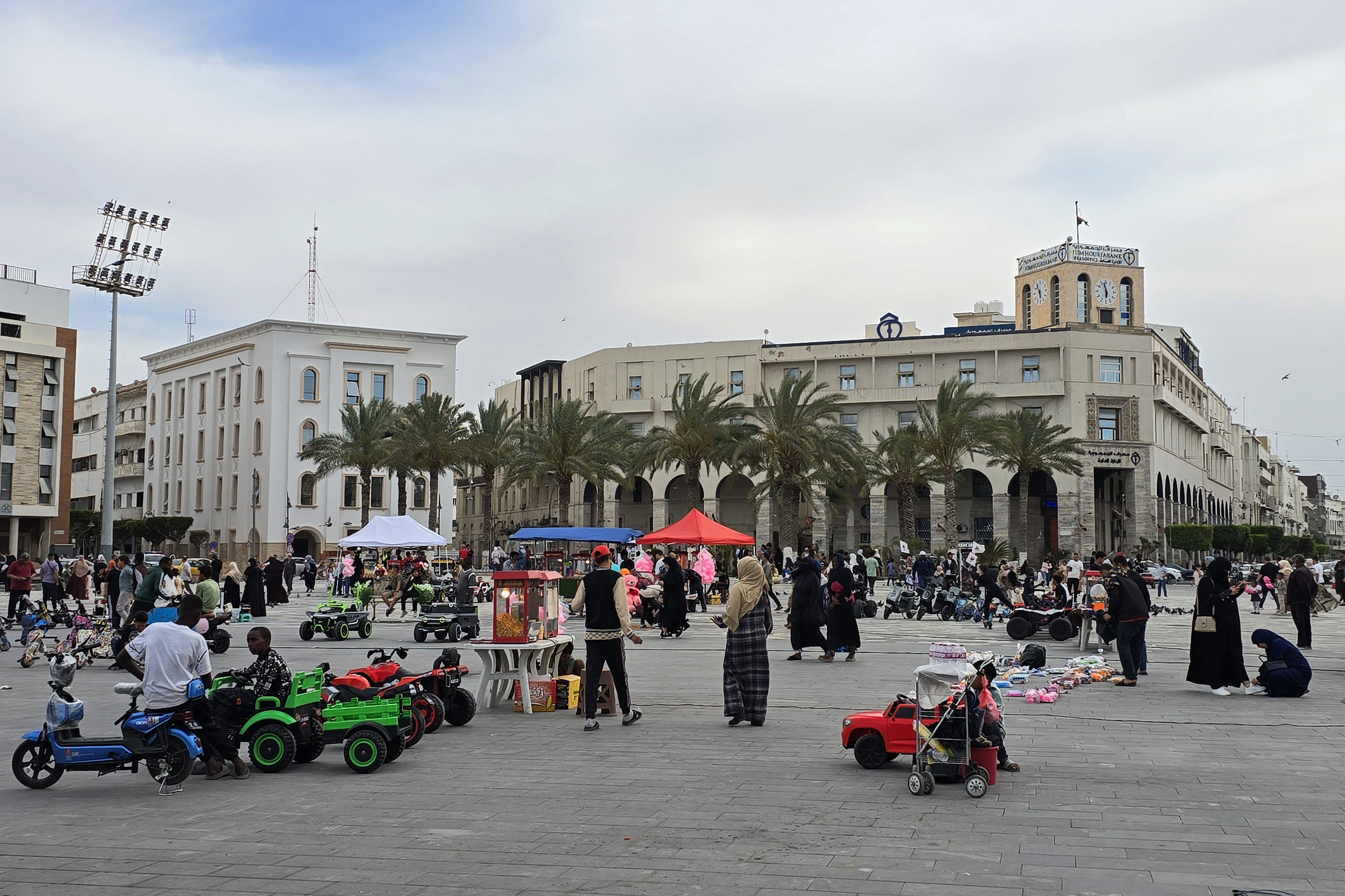 People walk in Martyrs square in Libya's capital Tripoli on May 10, 2025.