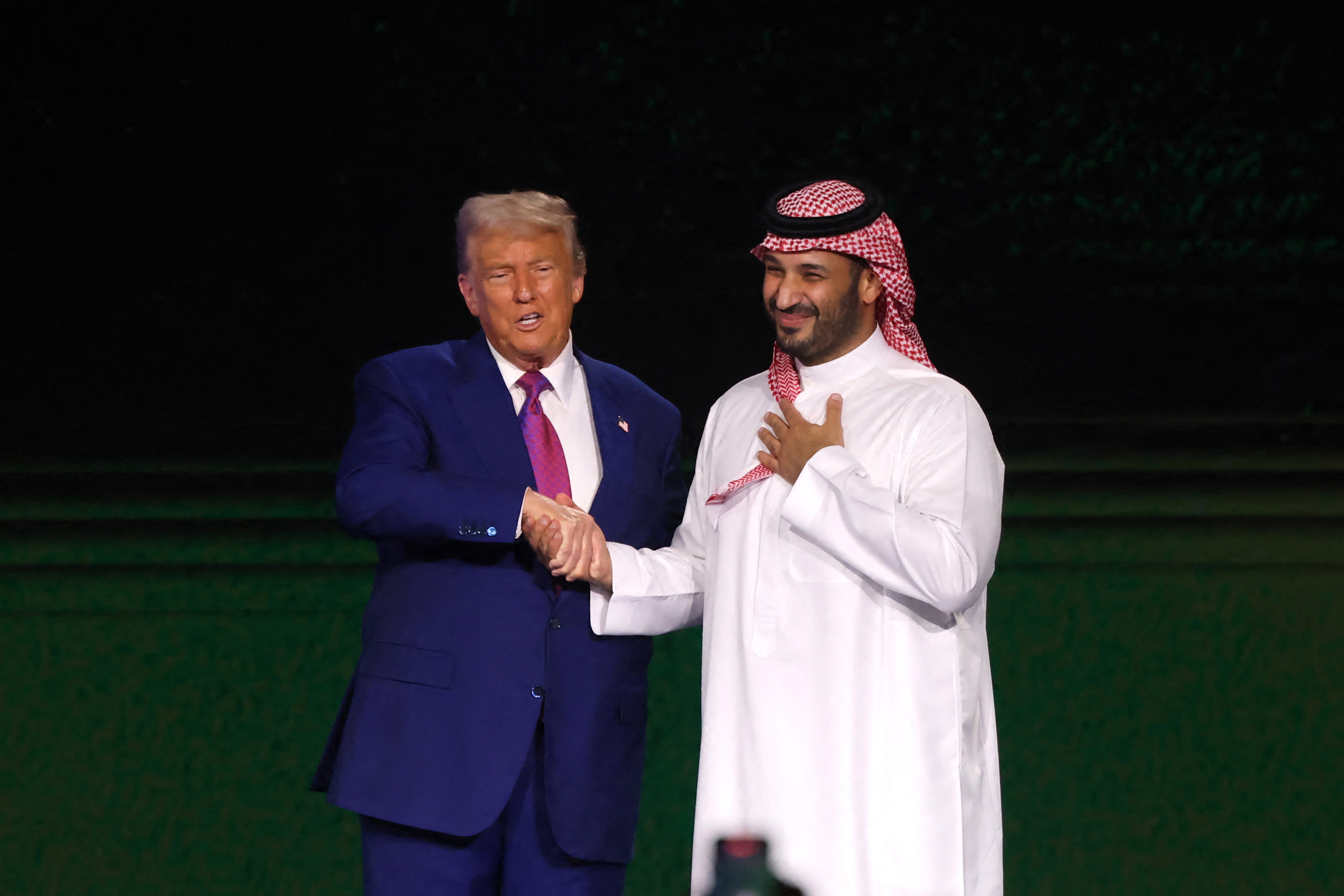 US President Donald Trump greets Saudi Crown Prince Mohammed bin Salman during the Saudi-US investment forum at the King Abdul Aziz International Conference Center in Riyadh on May 13, 2025. [Fayez Nureldine/AFP]