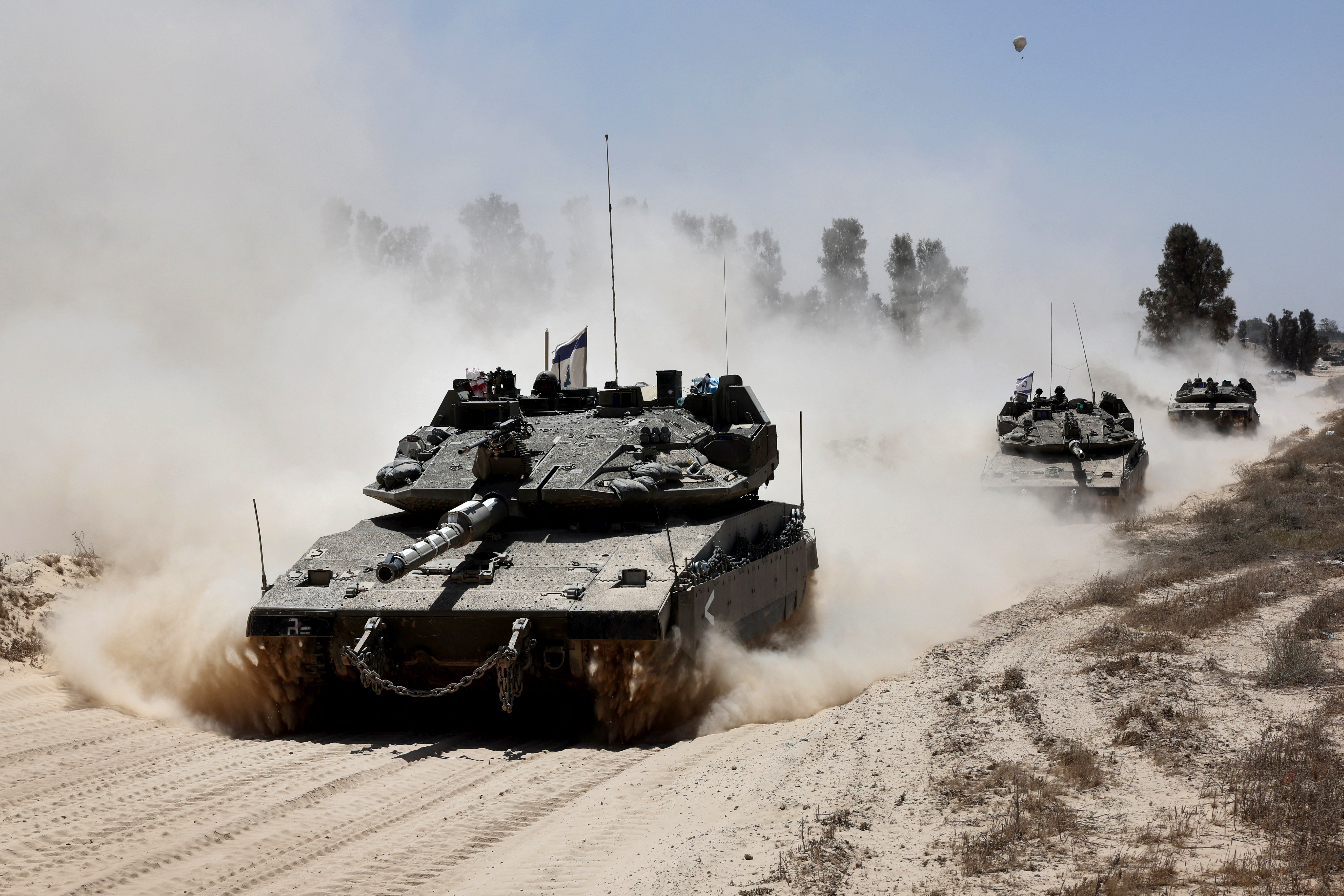 Israeli military vehicles deploy at Israel's southern border with the Gaza Strip on May 20, 2025 amid the ongoing war with the Palestinian militant movement Hamas. (Photo by Jack GUEZ / AFP)