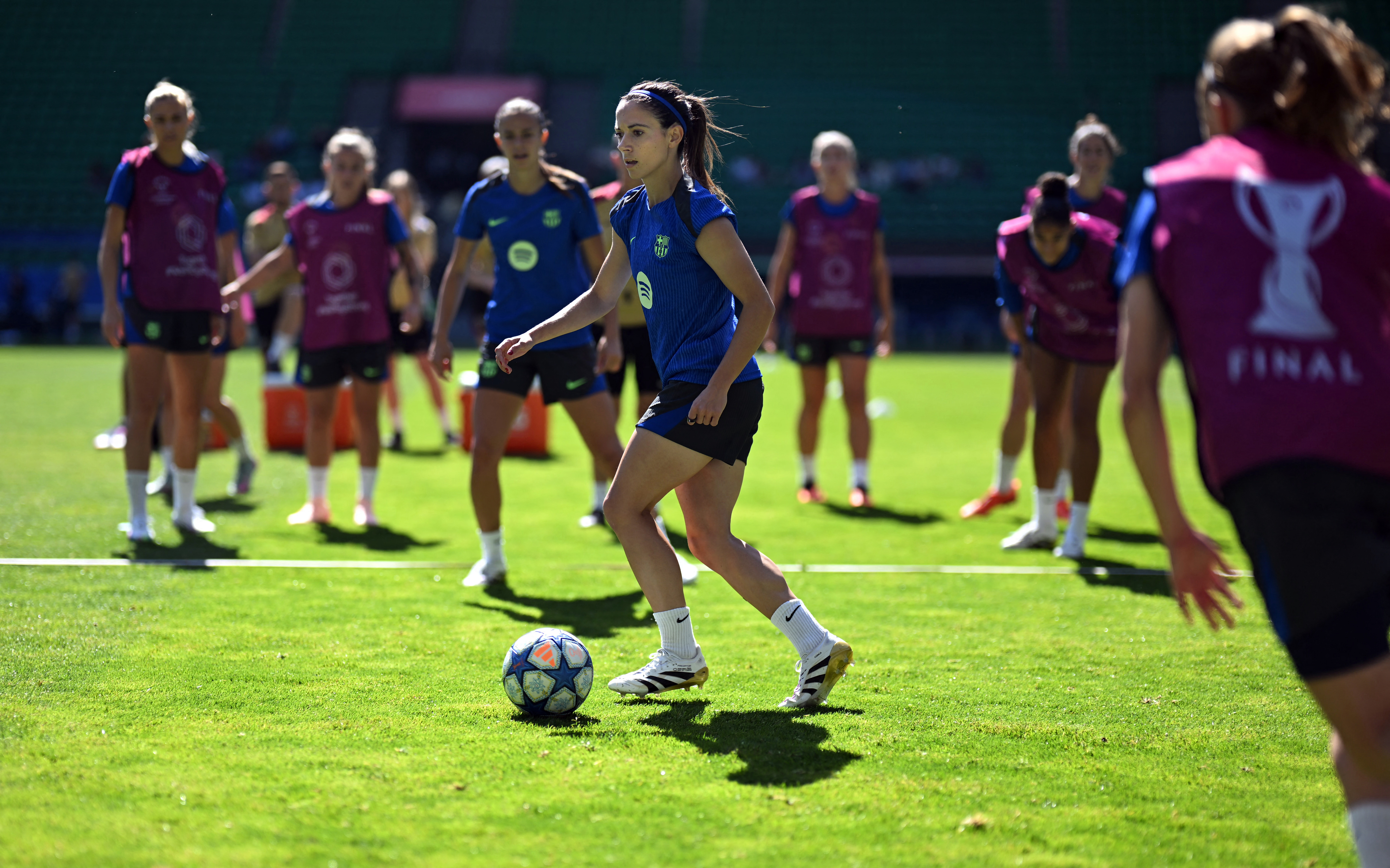 Barcelona's Spanish midfielder #14 Aitana Bonmati (C) attends a training session on the eve of the UEFA Women's Champions League final football match between Arsena