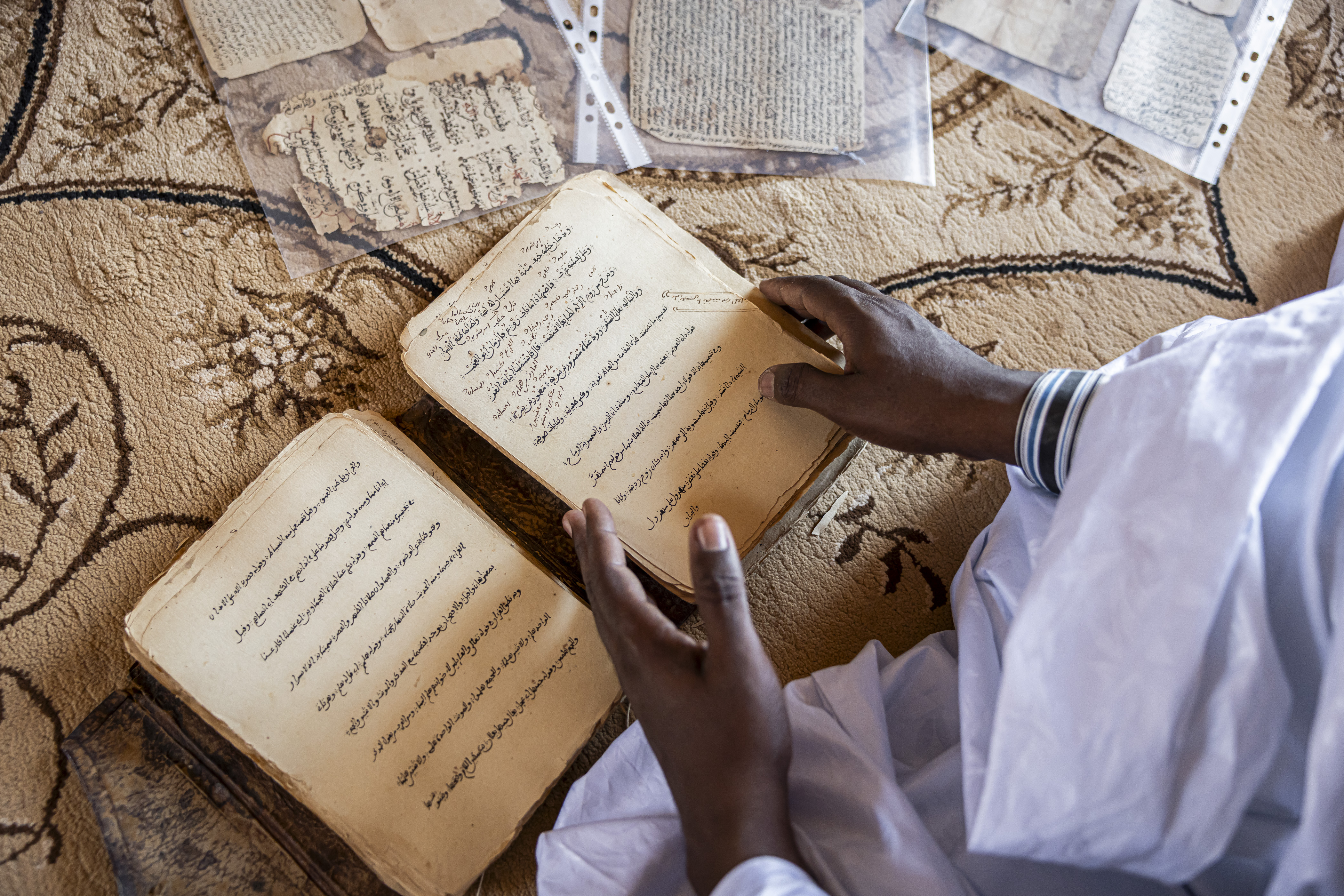 Library manager Mohamed Ben Baty shows an old manuscript