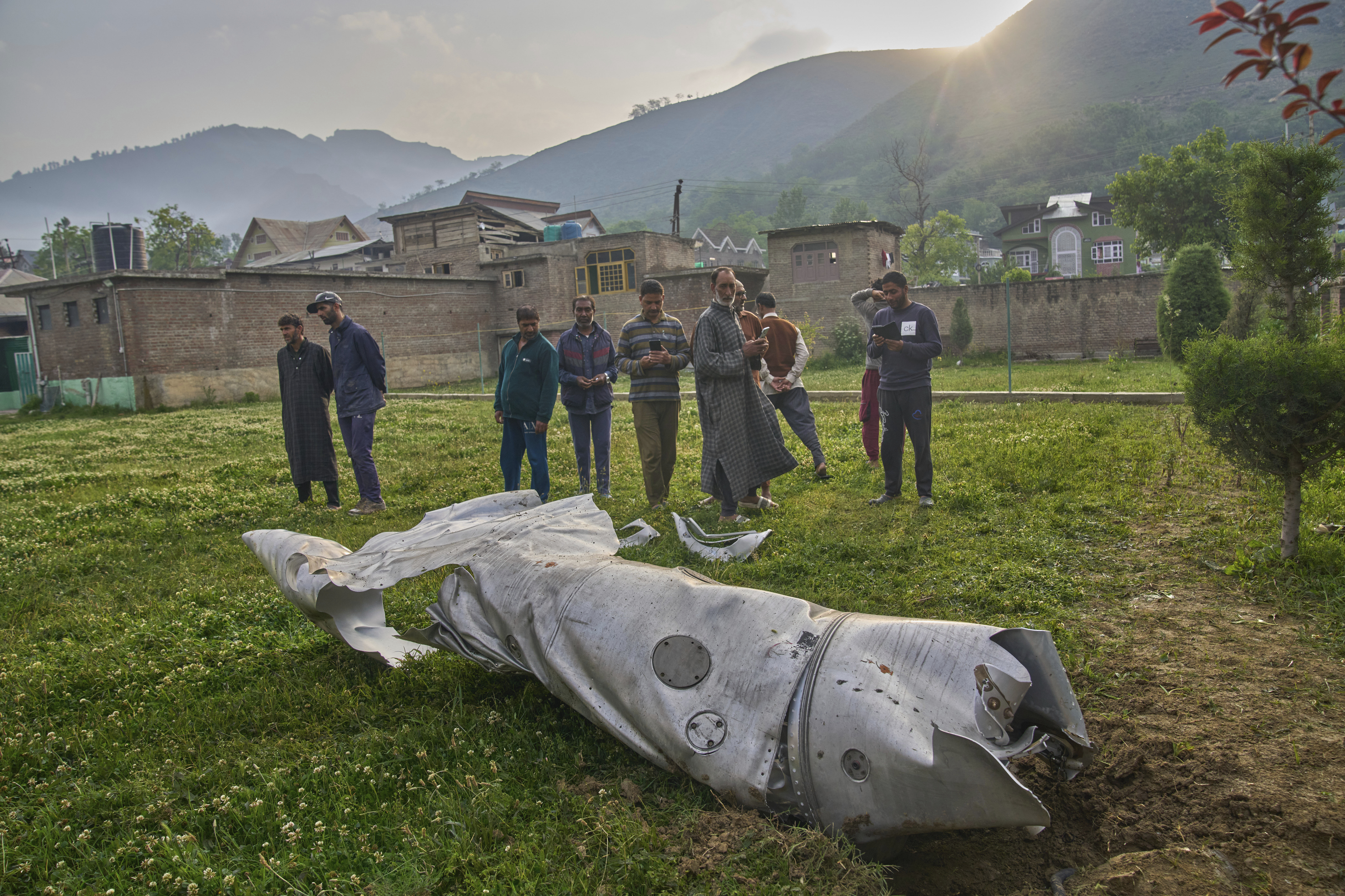 Debris of an aircraft lie in the compound of a mosque at Pampore in Pulwama district of Indian controlled Kashmir