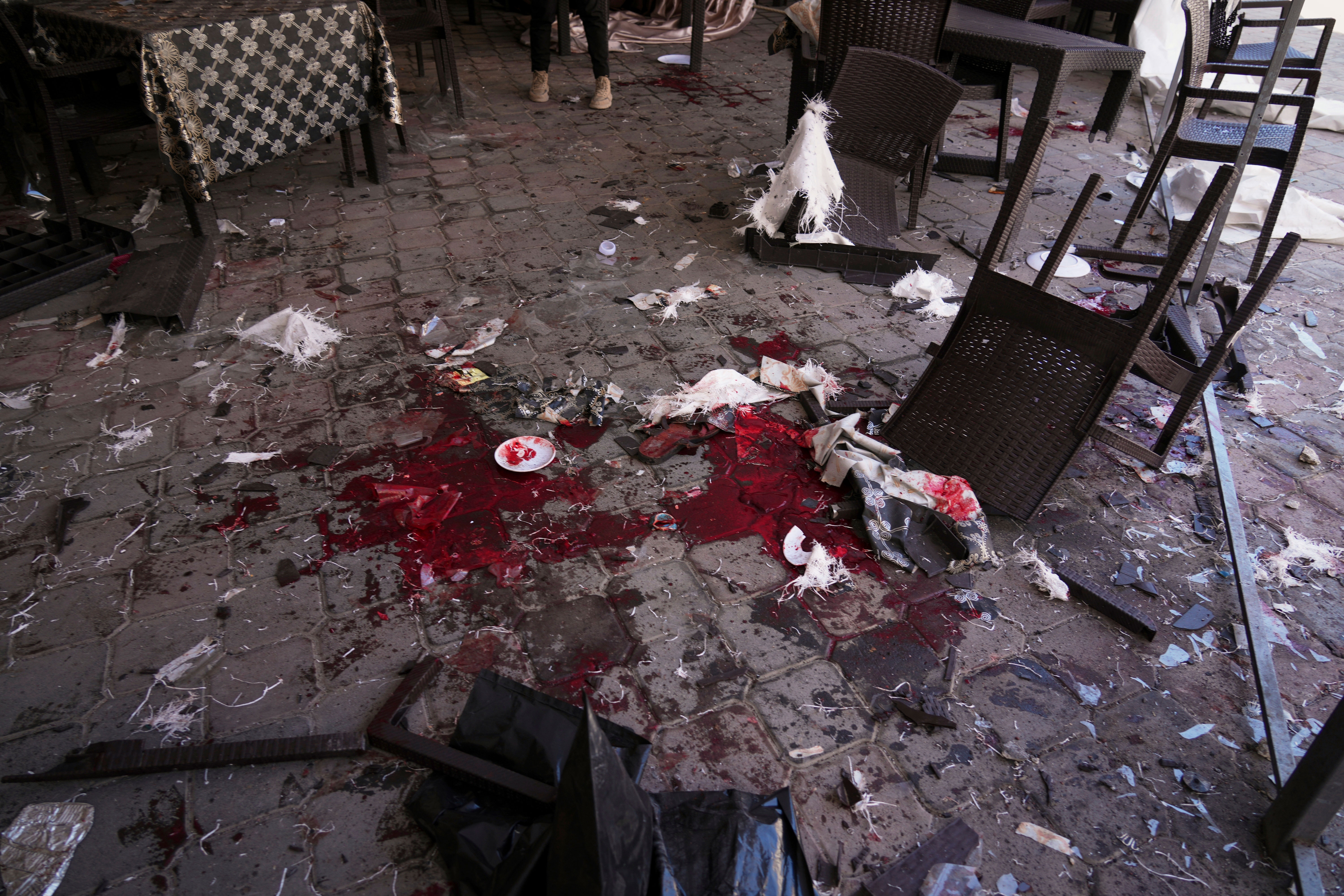 Blood is splattered across the floor following an Israeli army strike on a restaurant that killed at least 29 people in Gaza City, Wednesday, May 7, 2025.