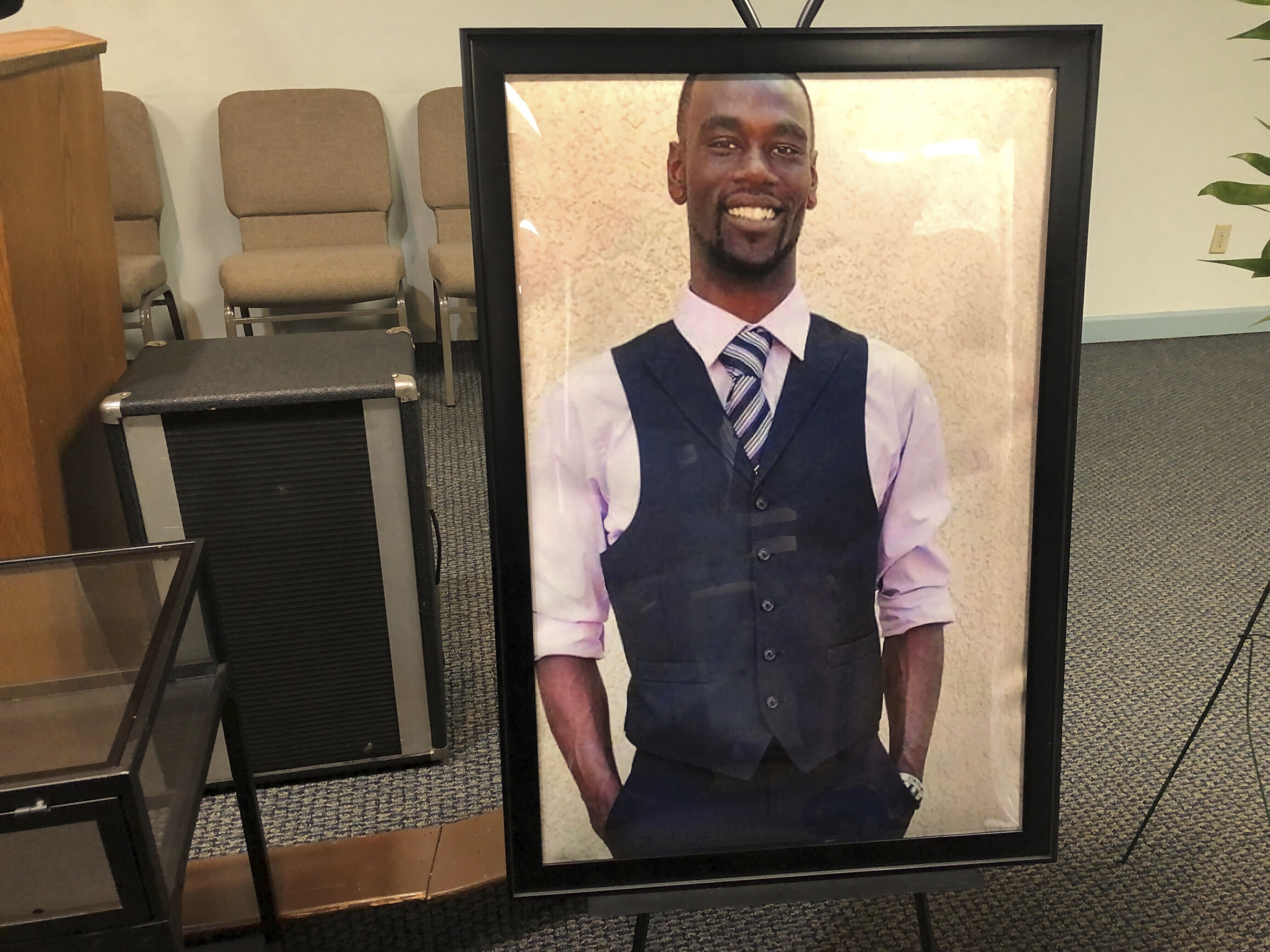 A portrait of Tyre Nichols at a memorial service.