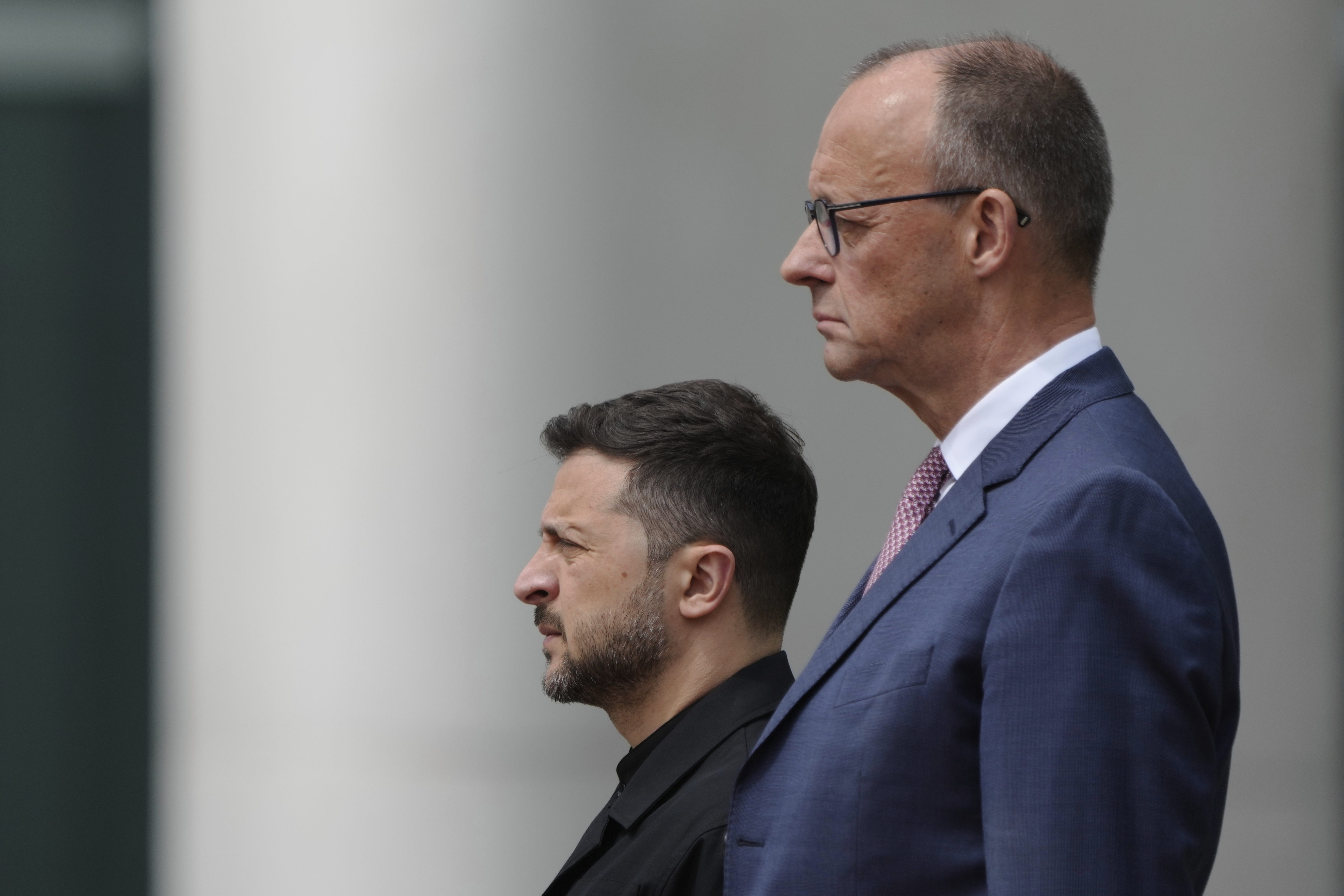 Germany's Chancellor Friedrich Merz, foreground, welcomes Ukraine's President Volodymyr Zelenskyy during an official military reception at the chancellery in Berlin, Germany, Wednesday, May 28, 2025.(AP Photo/Markus Schreiber)