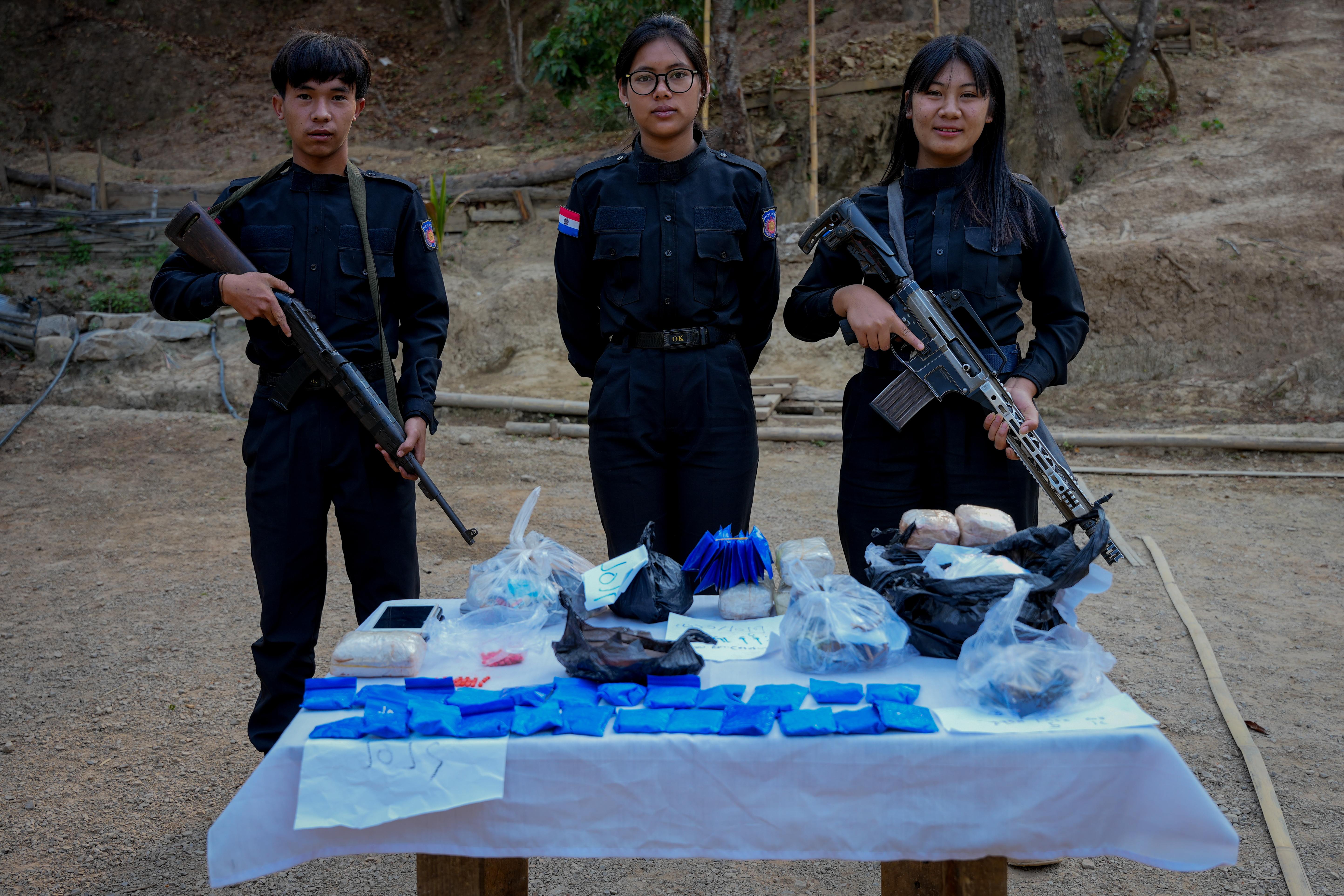 023 – Young Karenni officers pose in front of the seized drugs.