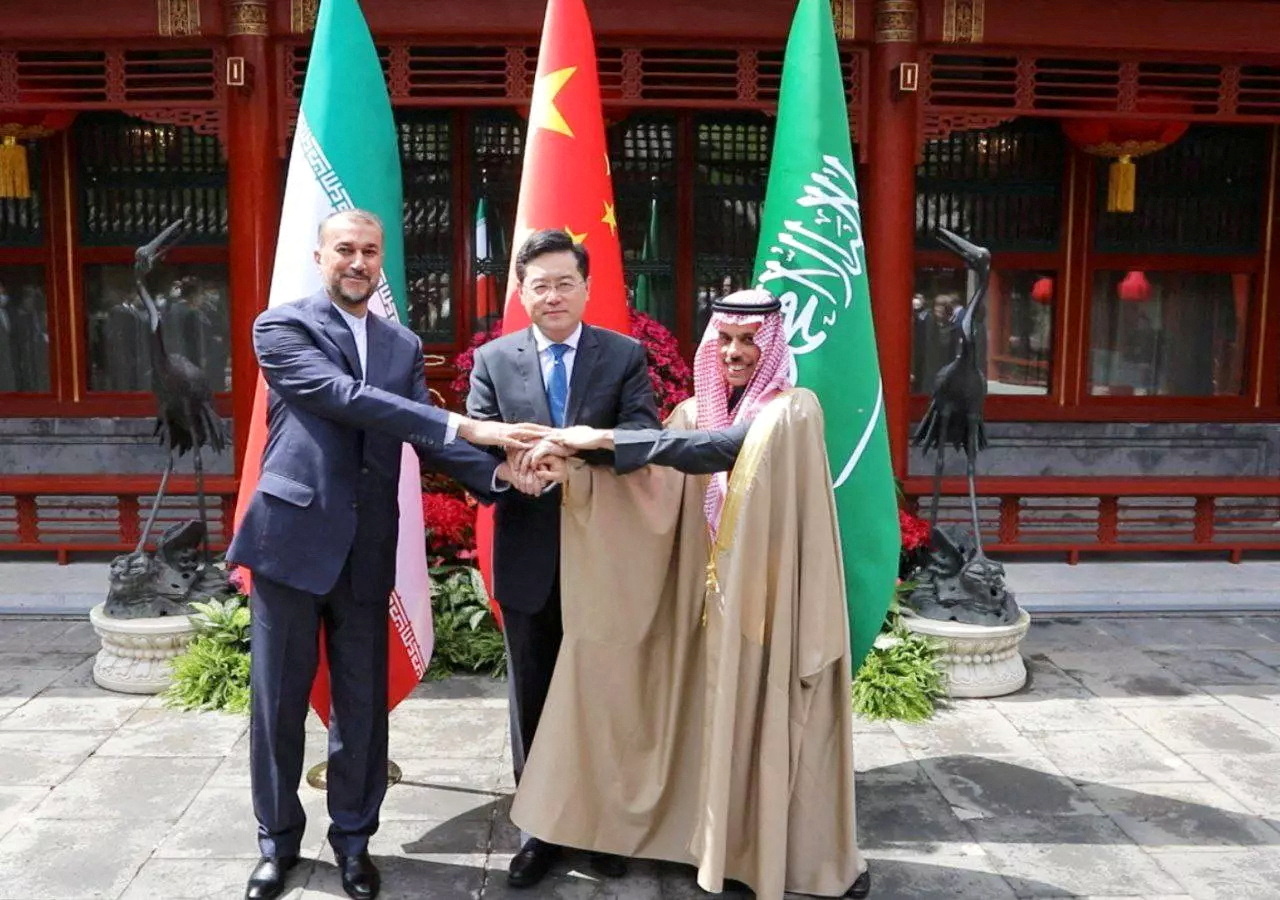 Iranian Foreign Minister Hossein Amir-Abdollahian and Saudi Arabia's Foreign Minister Prince Faisal bin Farhan Al Saud and Chinese Foreign Minister Qin Gang shake hands during a meeting in Beijing, China, April 6, 2023. Iran's Foreign Ministry/WANA (West Asia News Agency)/Handout via REUTERS ATTENTION EDITORS - THIS PICTURE WAS PROVIDED BY A THIRD PARTY TPX IMAGES OF THE DAY