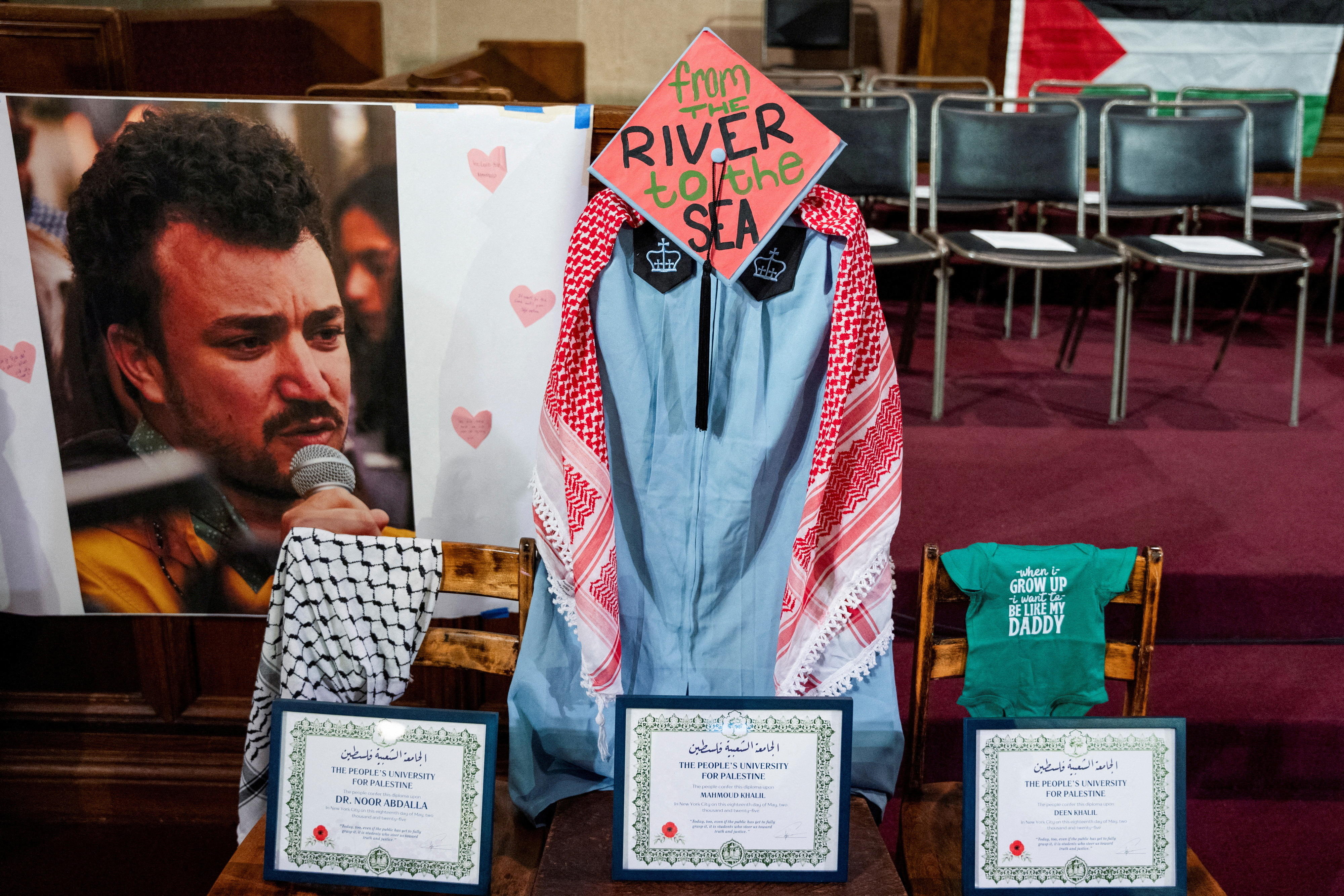 A display shows a photo of Mahmoud Khalil and a graduation cap and gown.