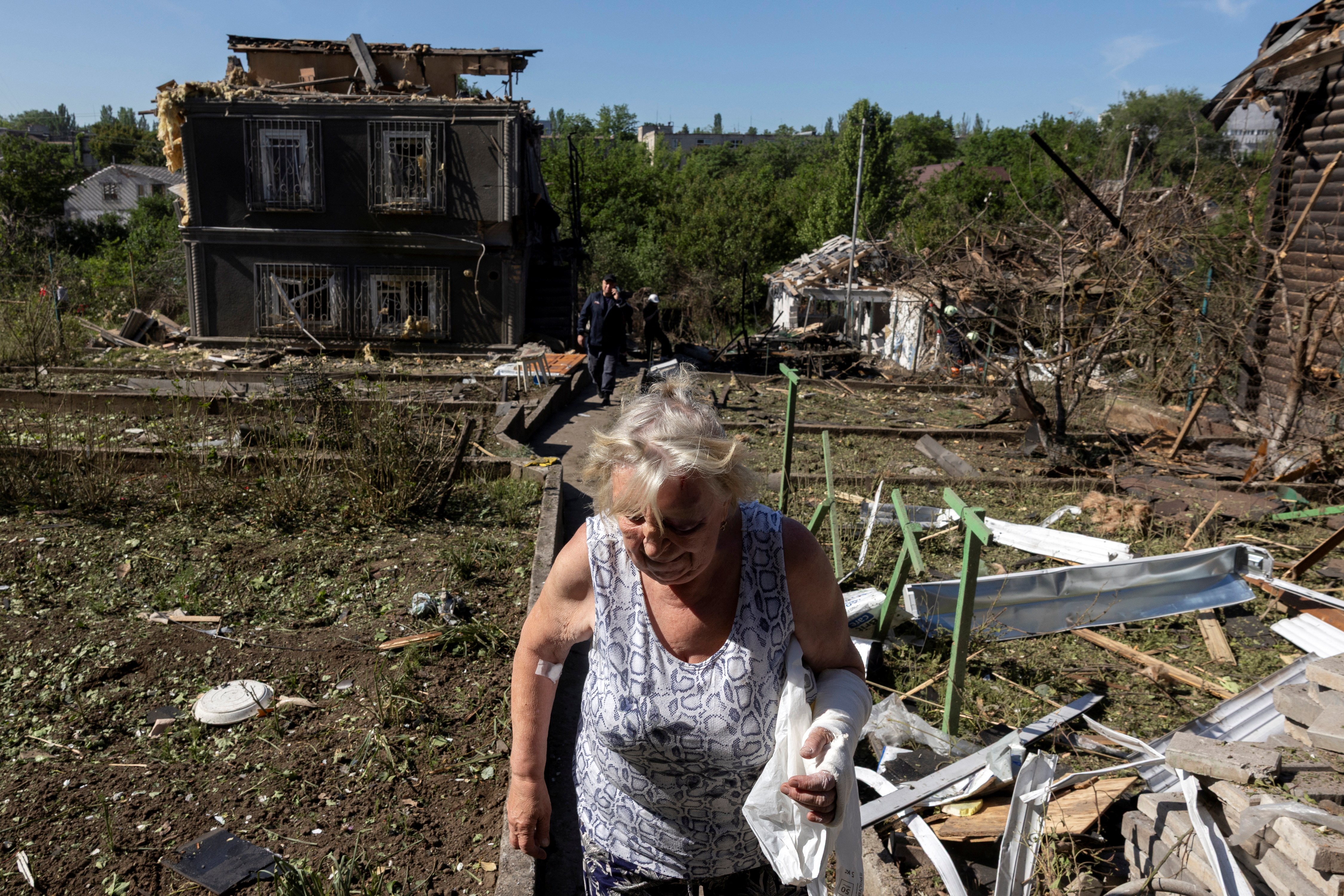 Local resident Lyudmila Tsinkush leaves her house that was damaged in a Russian drones strike, amid Russia's attack on Ukraine, in Zaporizhzhia, Ukraine, June 1, 2025. REUTERS/Thomas Peter