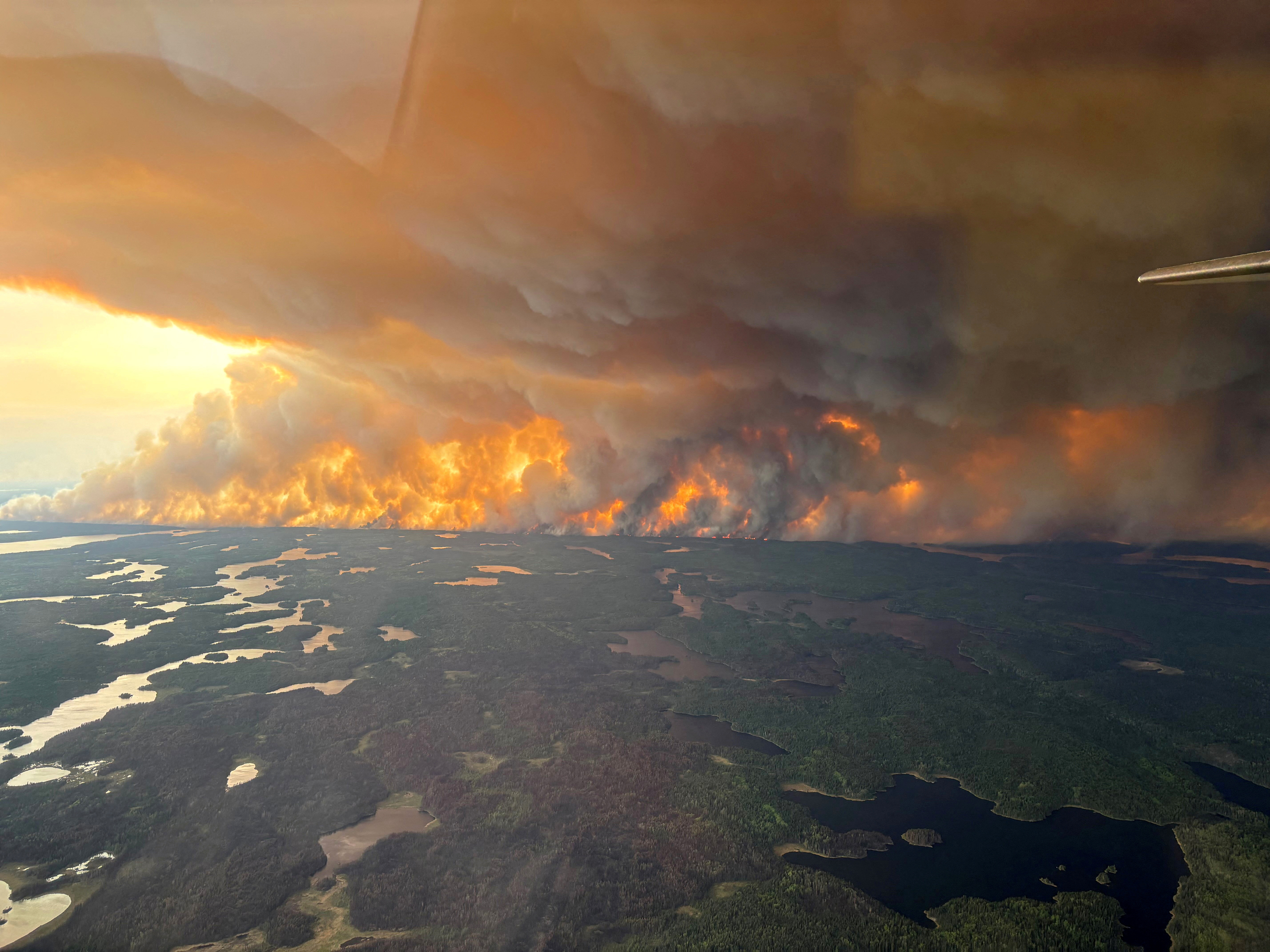 FILE PHOTO: Smoke rises from wildfire WE024 which has prompted a pre-evacuation notice in Flin Flon, Manitoba, Canada May 27, 2025. Manitoba Government/Handout via REUTERS. THIS IMAGE HAS BEEN SUPPLIED BY A THIRD PARTY/File Photo