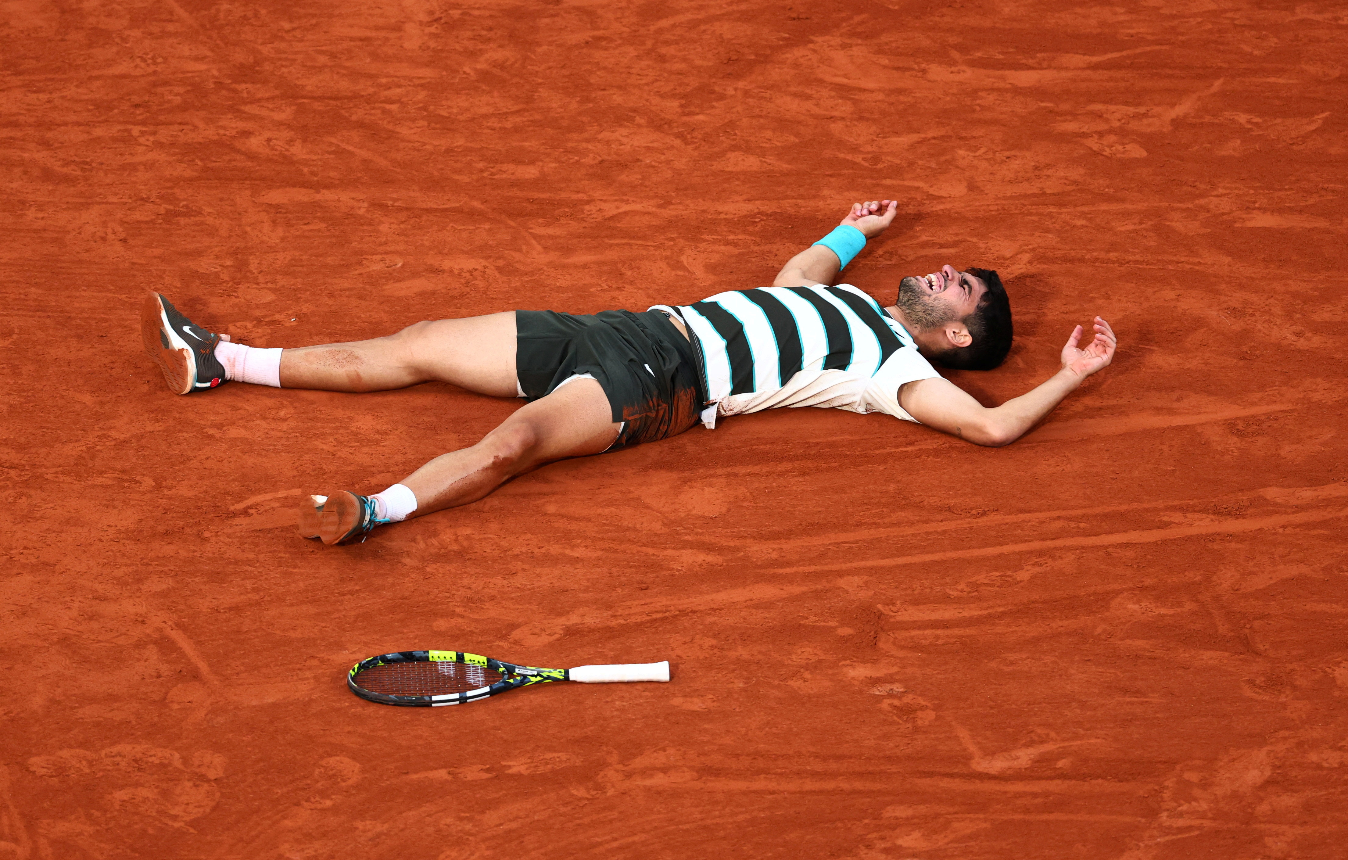French Open - Roland Garros, Paris, France - June 8, 2025 Spain's Carlos Alcaraz celebrates after winning the men's singles final against Italy's Jannik Sinner