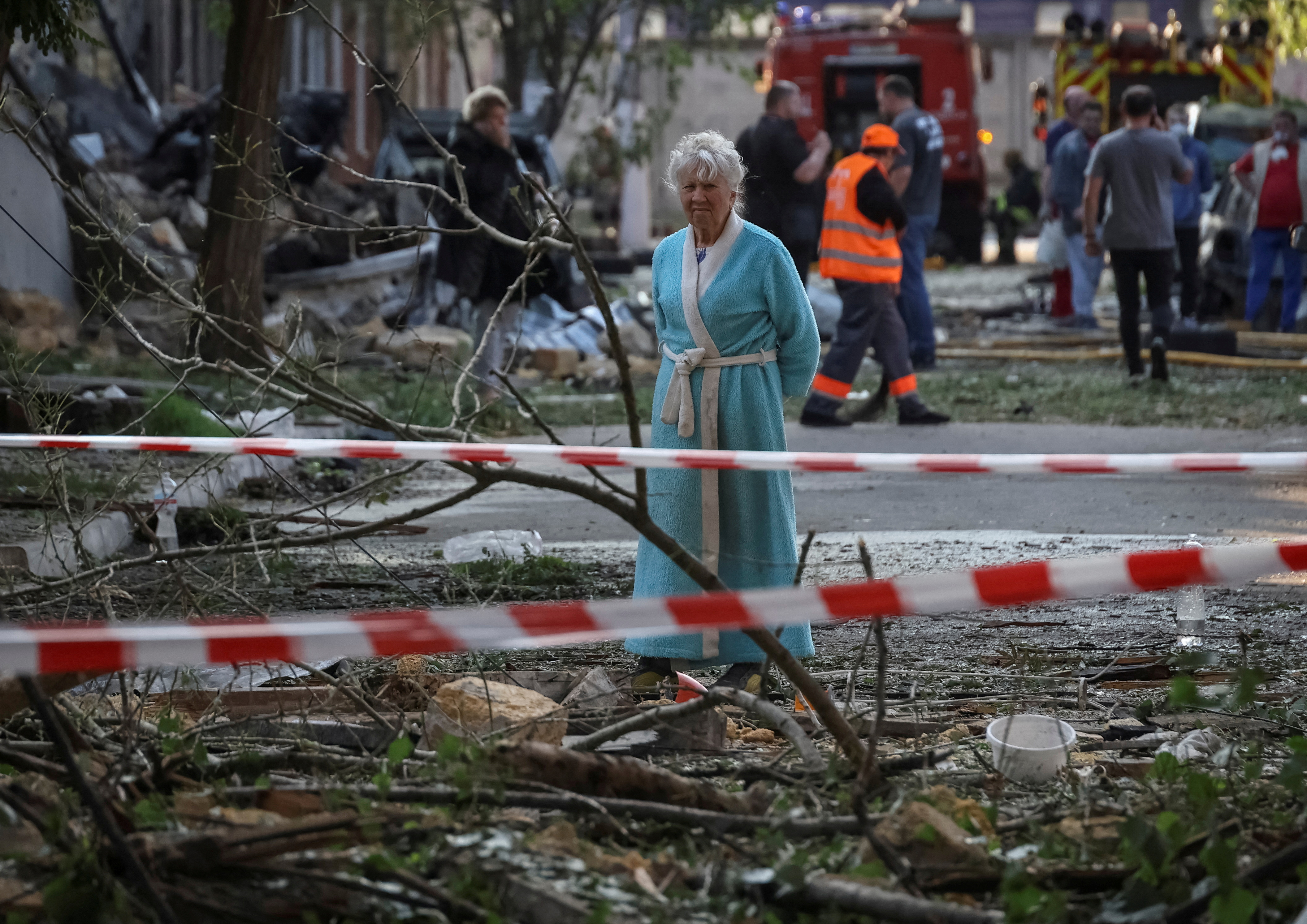 A resident stands at the site of an apartment building hit by a Russian drone strike, amid Russia's attack on Ukraine, in Odesa, Ukraine June 10, 2025. REUTERS/Nina Liashonok