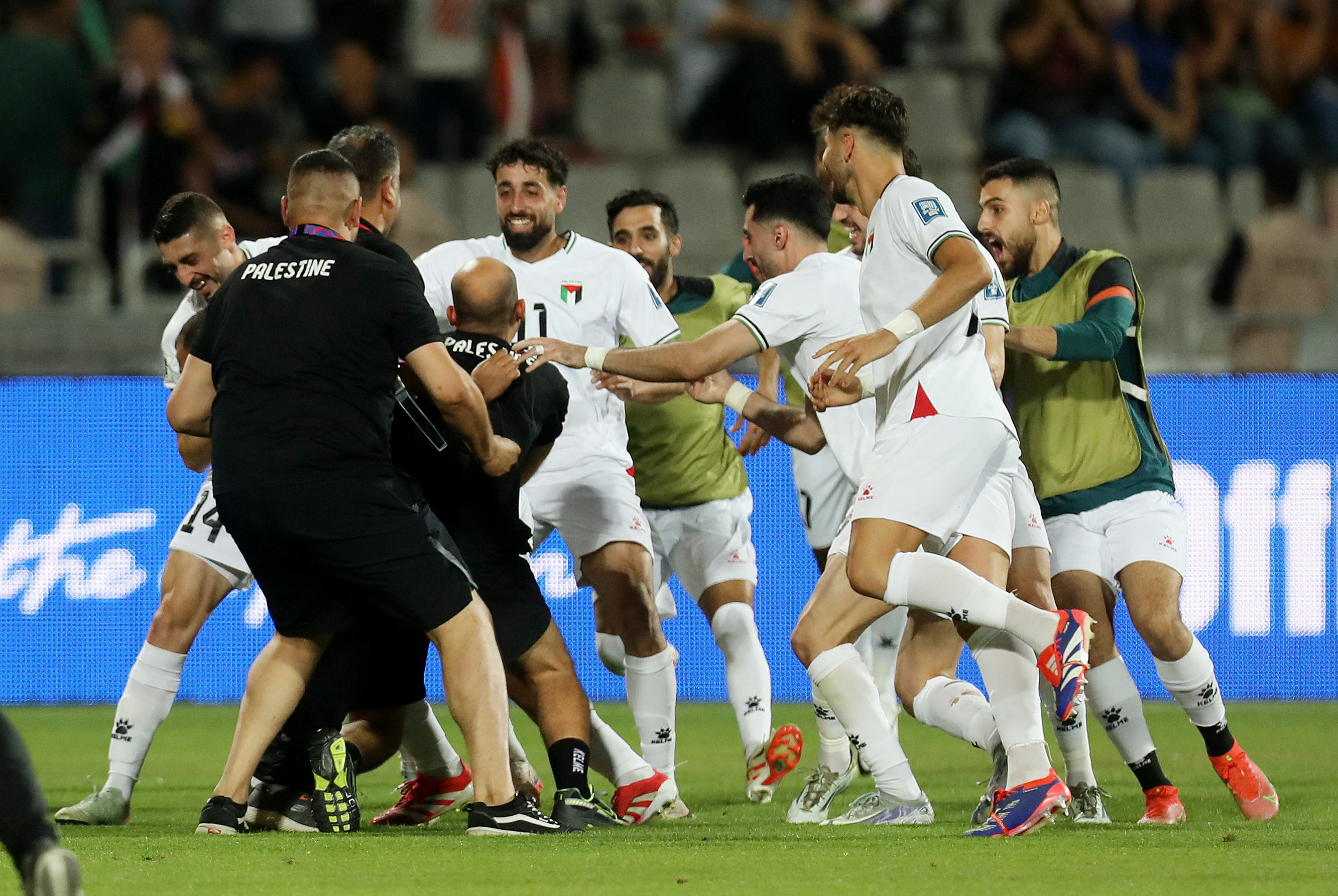 World Cup - AFC Qualifiers - Group B - Palestine v Oman - King Abdullah II Stadium, Amman, Jordan - June 10, 2025 Palestine's Oday Kharoub celebrates scoring their first goal with teammates