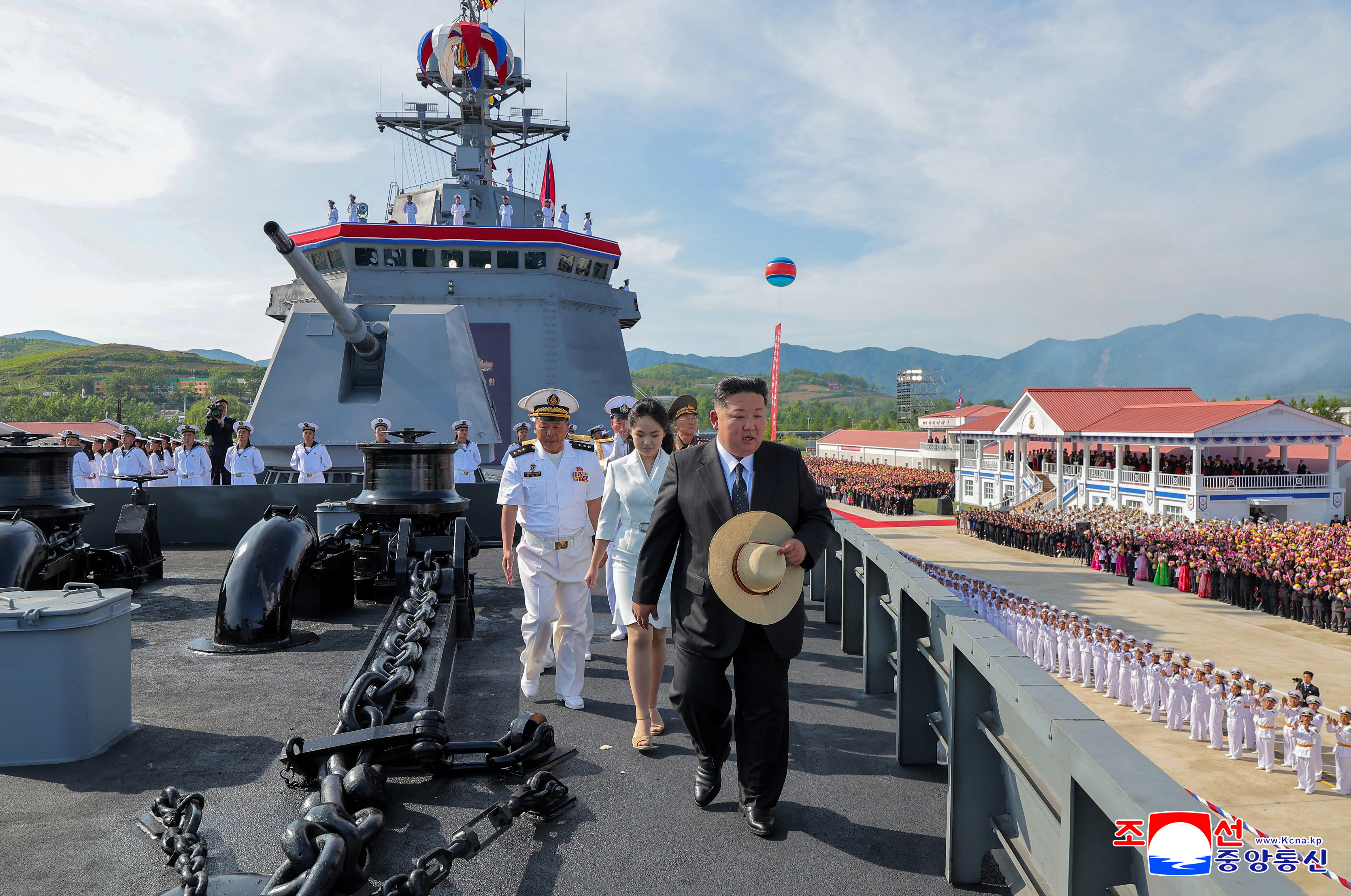 North Korean leader Kim Jong Un and his daughter Kim Ju Ae attend the launching ceremony of a warship that had been damaged upon its first attempt to launch, in Rajin, North Korea, June 12, 2025 in this photo released by North Korea's official Korean Central News Agency. KCNA via REUTERS ATTENTION EDITORS - THIS IMAGE WAS PROVIDED BY A THIRD PARTY. REUTERS IS UNABLE TO INDEPENDENTLY VERIFY THIS IMAGE. NO THIRD PARTY SALES. SOUTH KOREA OUT. NO COMMERCIAL OR EDITORIAL SALES IN SOUTH KOREA.