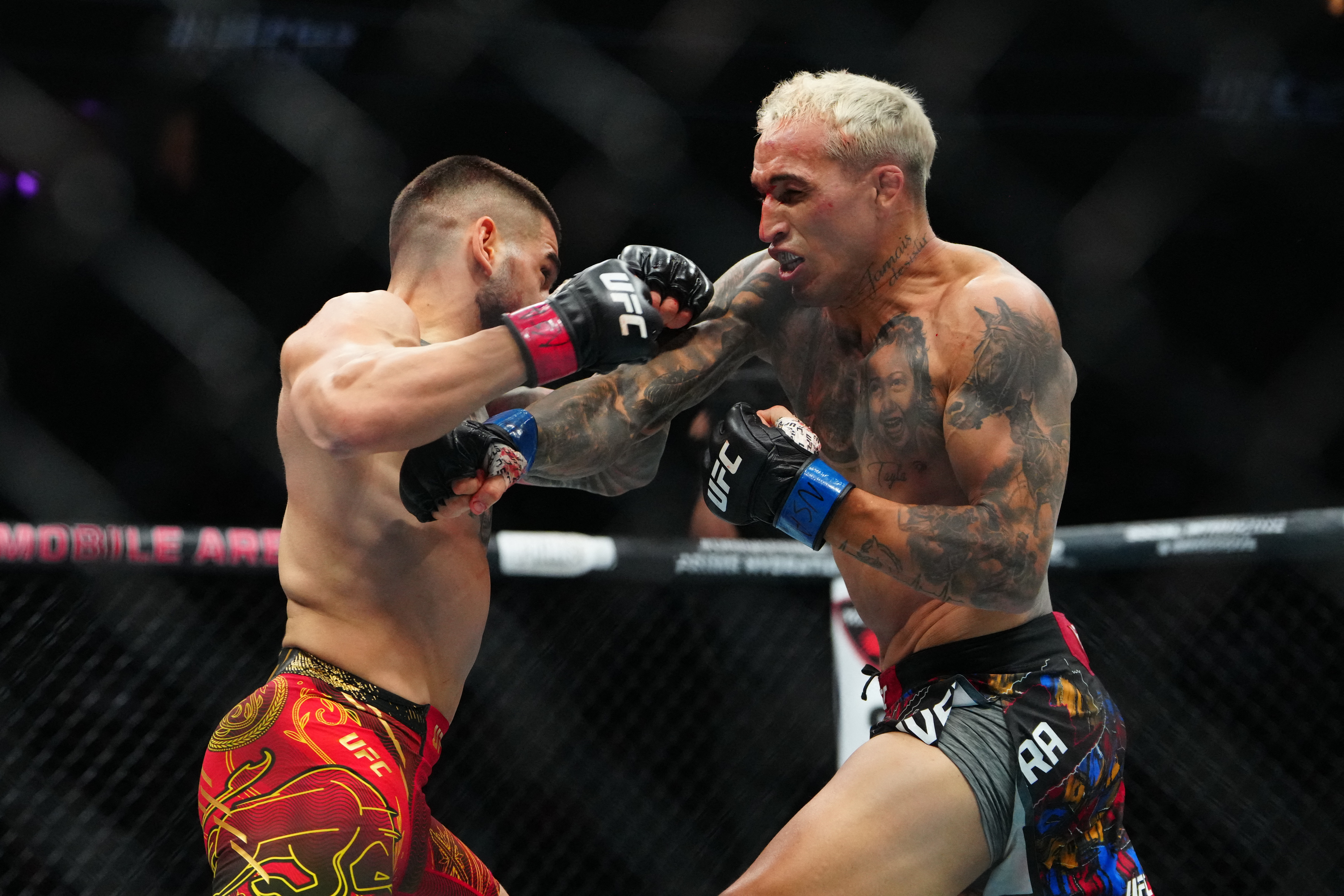 Topuria and Oliveira throw punches