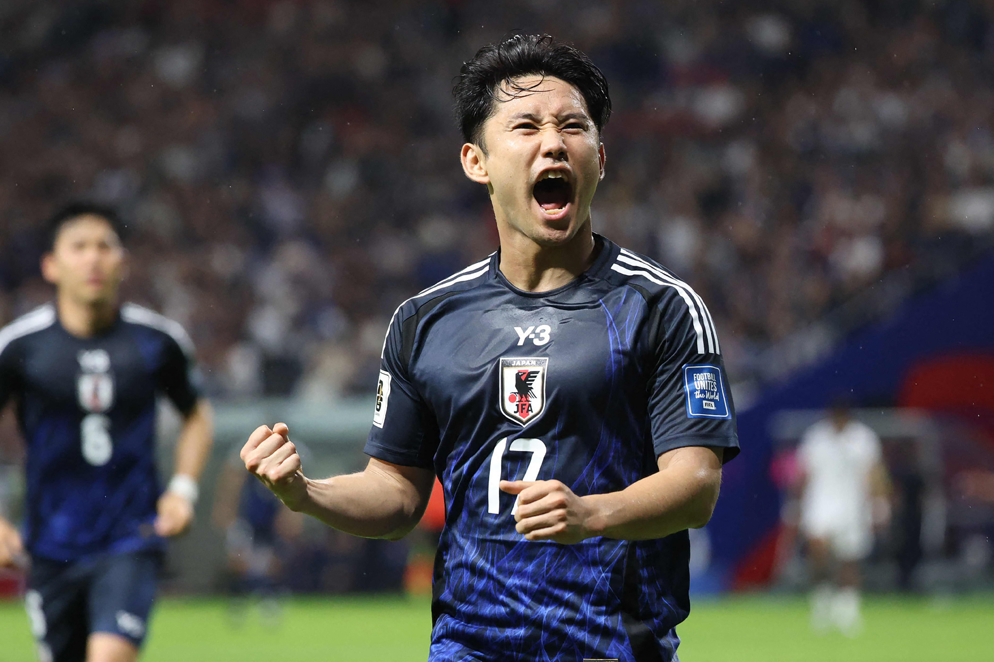 Japan's midfielder Ryoya Morishita celebrates after scoring his team's fourth goal during the World Cup Asian qualifier match against Indonesia