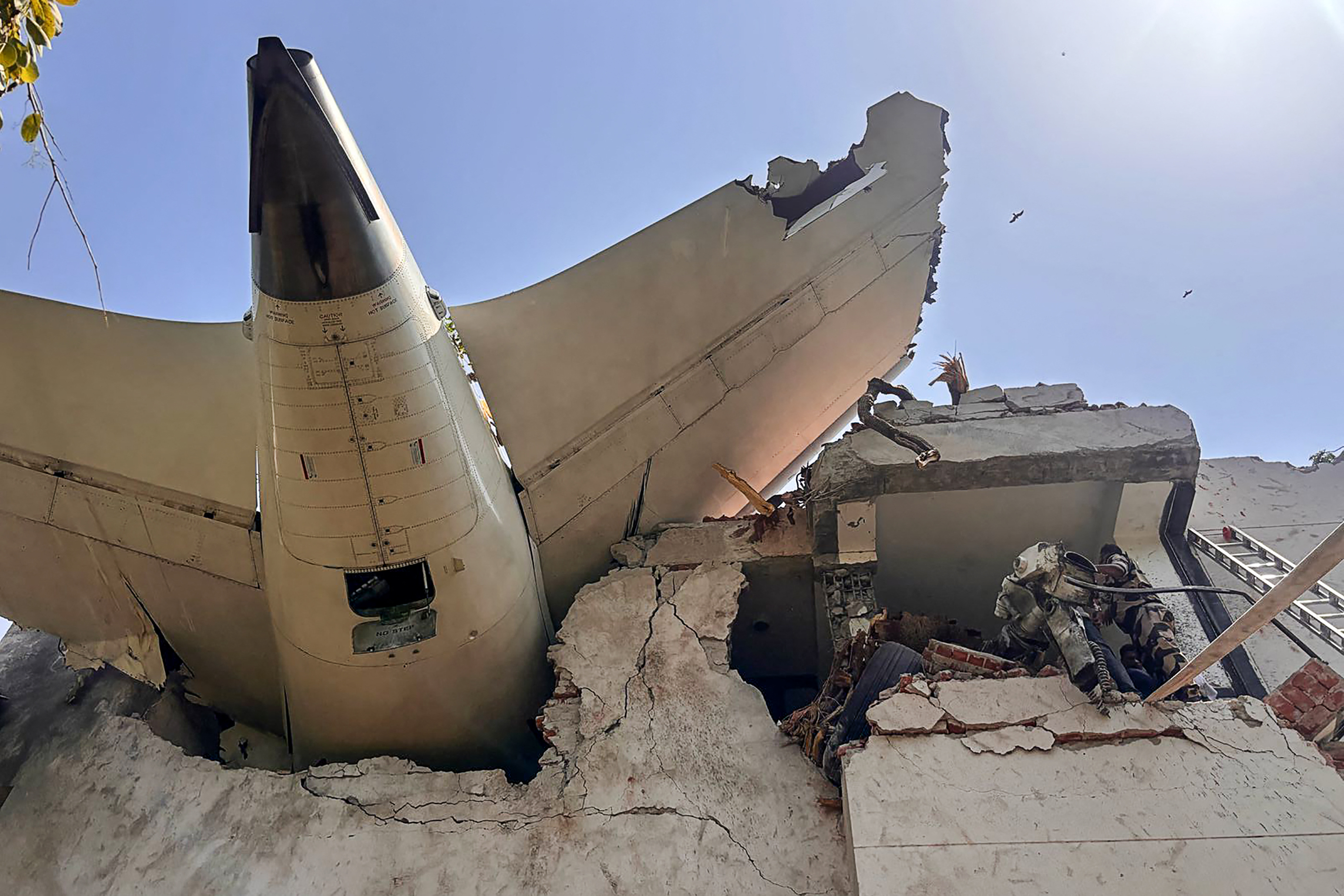 the back of an Air India plane after it crashed in a residential area near the airport in Ahmedabad.