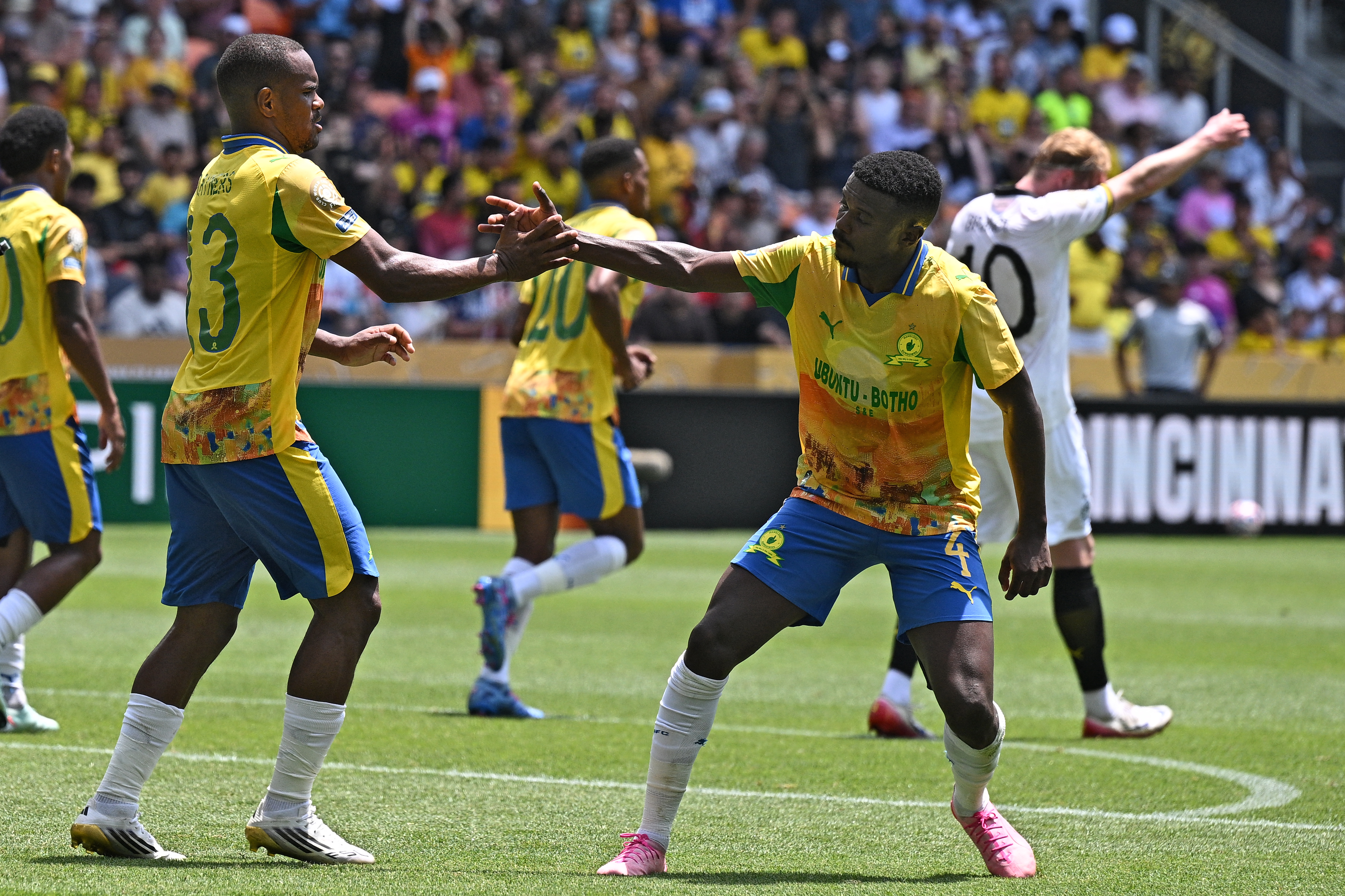 Sundowns' South African forward #13 Iqraam Rayners (L) is congratulated by Sundowns' South African midfielder #4 Teboho Mokoena after scoring his team's second goal during the FIFA Club World Cup 2025 Group F football match between South Africa's Mamelodi Sundowns and Germany's Borussia Dortmund at the TQL stadium in Cincinnati on June 21, 2025. (Photo by Federico PARRA / AFP)