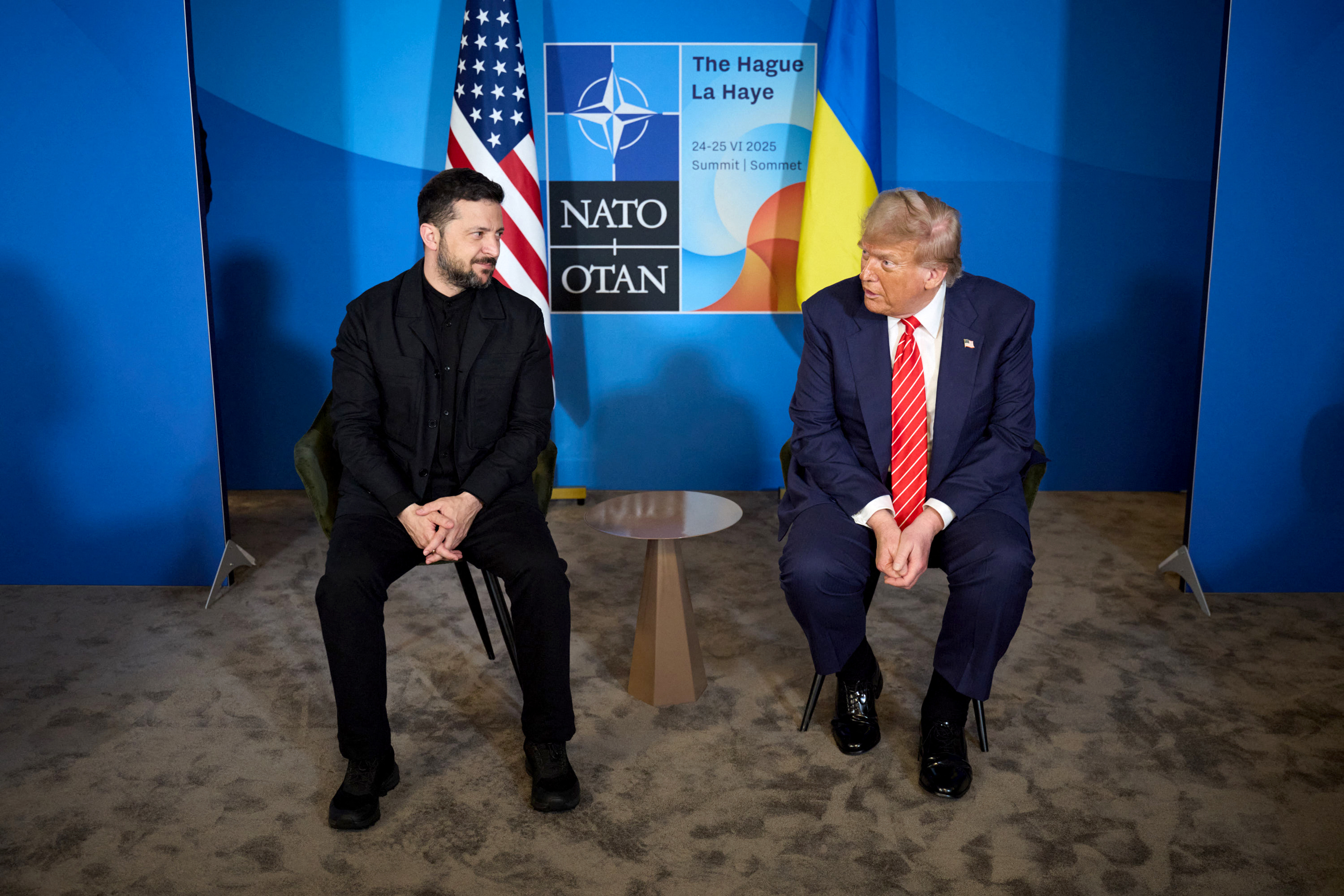 In this handout photograph taken and released by the Ukrainian Presidential Press Service on June 25, 2025, Ukraine's President Volodymyr Zelensky (L) meets with US President Donald Trump on the sideline of the North Atlantic Treaty Organization (NATO) summit in The Hague. (Photo by Handout / UKRAINIAN PRESIDENTIAL PRESS SERVICE / AFP) / RESTRICTED TO EDITORIAL USE - MANDATORY CREDIT "AFP PHOTO / UKRAINIAN PRESIDENTIAL PRESS SERVICE" - NO MARKETING NO ADVERTISING CAMPAIGNS - DISTRIBUTED AS A SERVICE TO CLIENTS