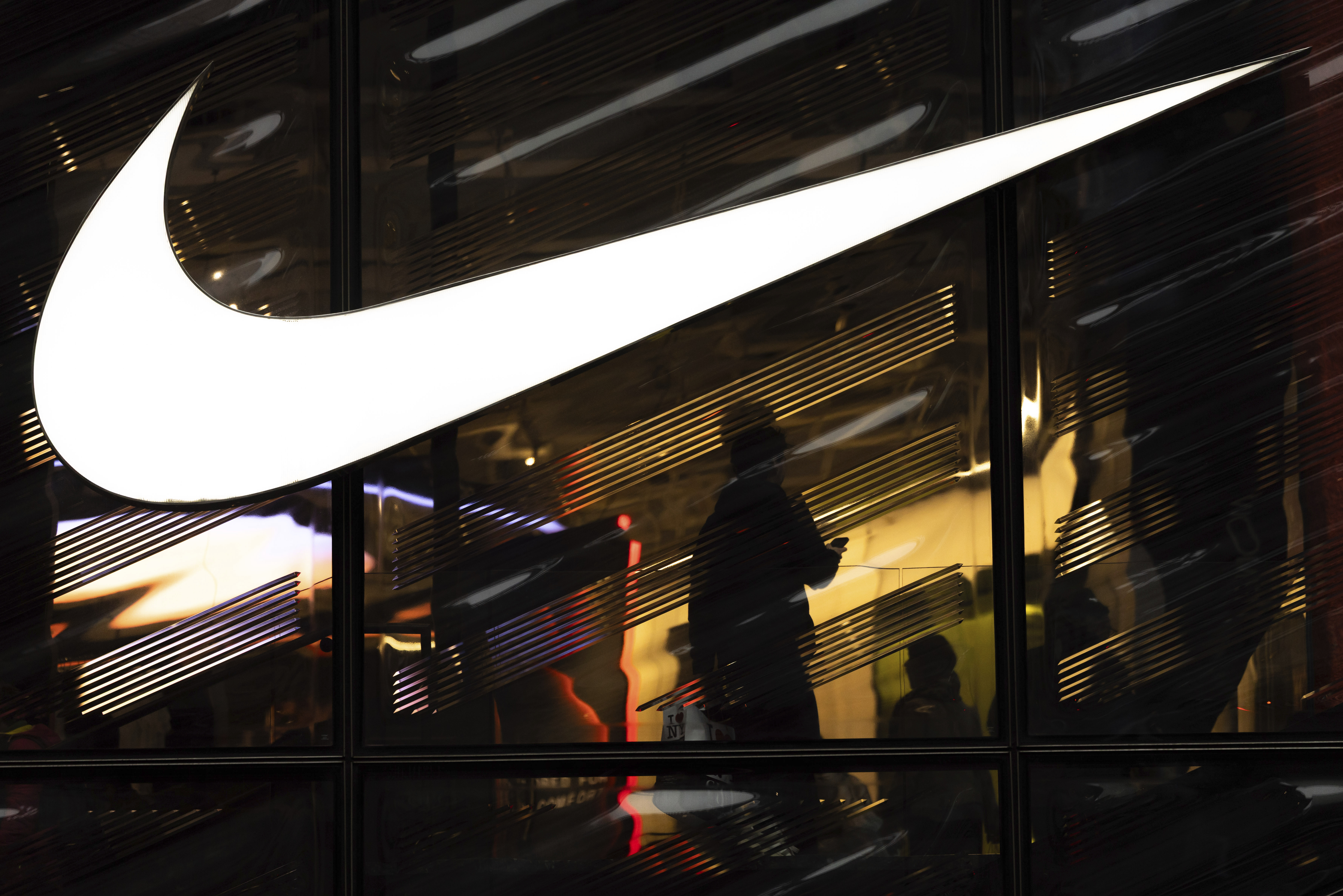 Nike signage is displayed outside the Nike store on the 5th Avenue, Monday, April 7, 2025, in New York. (AP Photo/Yuki Iwamura)