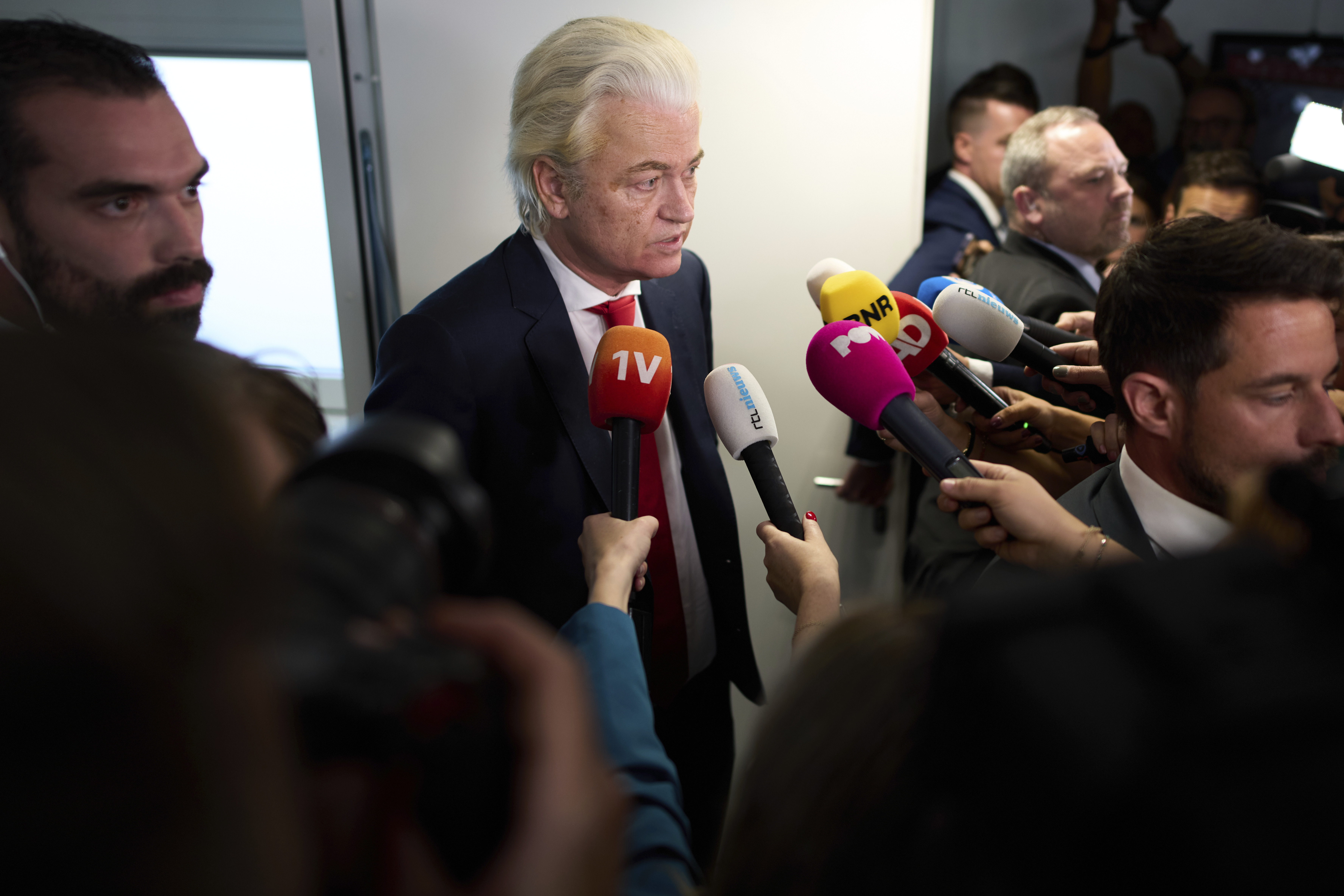 Far-right lawmaker Geert Wilders talks to the media after pulling his party out of the four-party Dutch coalition
